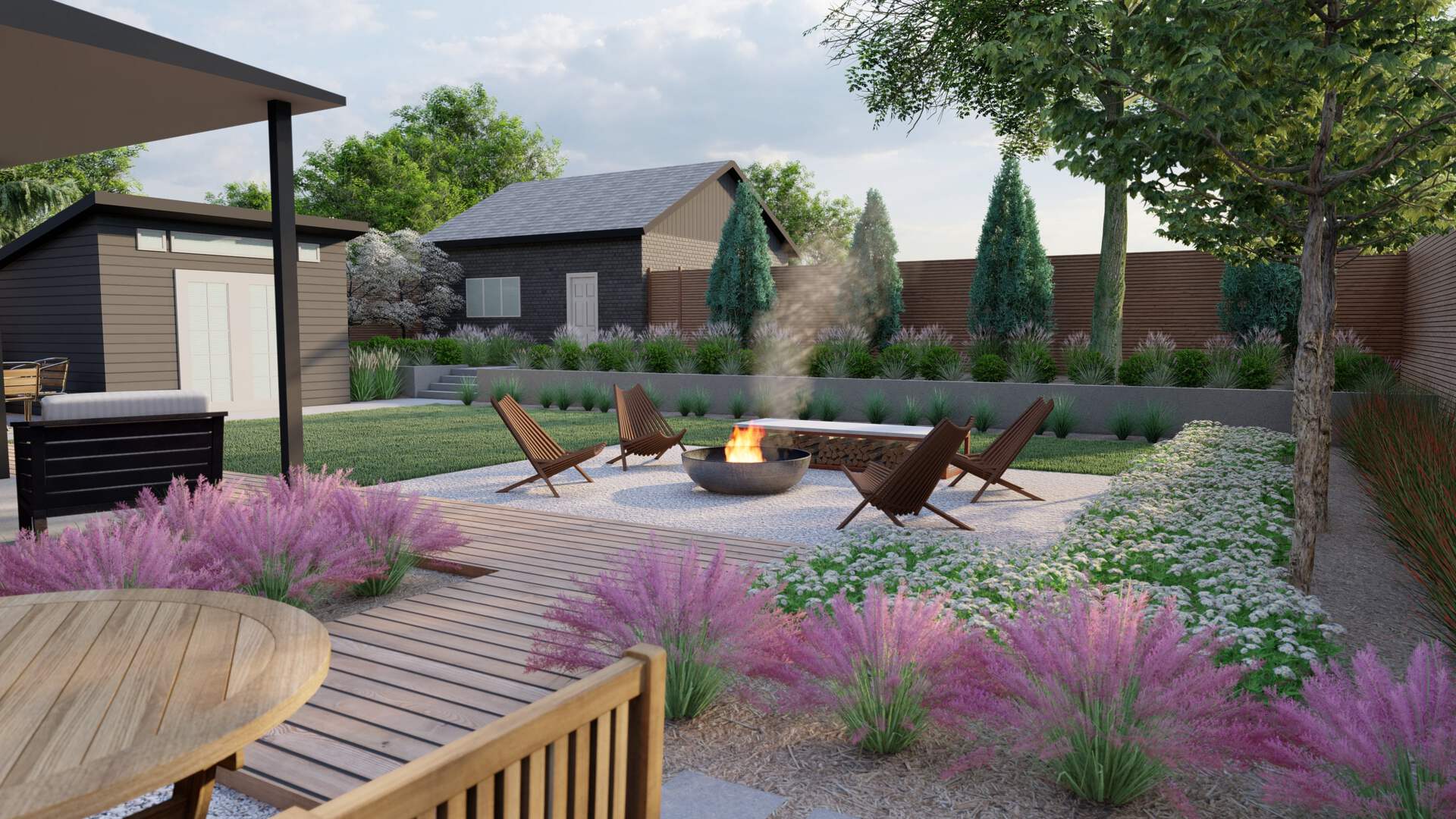 a backyard landscaping idea with a fire pit off a wood deck with a pergola. Concrete garden walls around the edge of the property with flowers