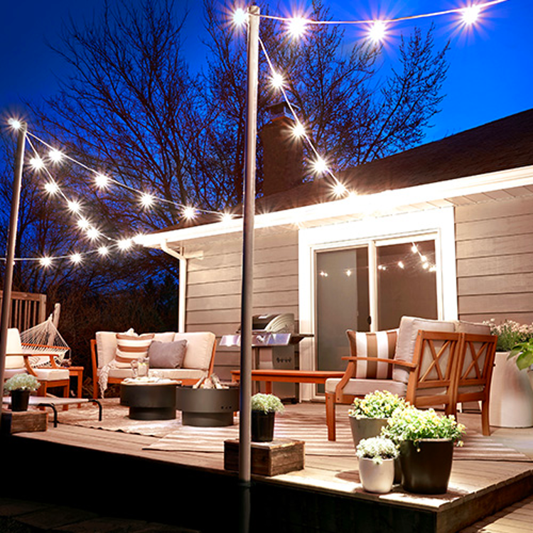 backyard deck ideas on a budget with string lights hanging overhead