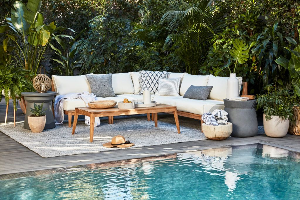Outdoor furniture next to a pool