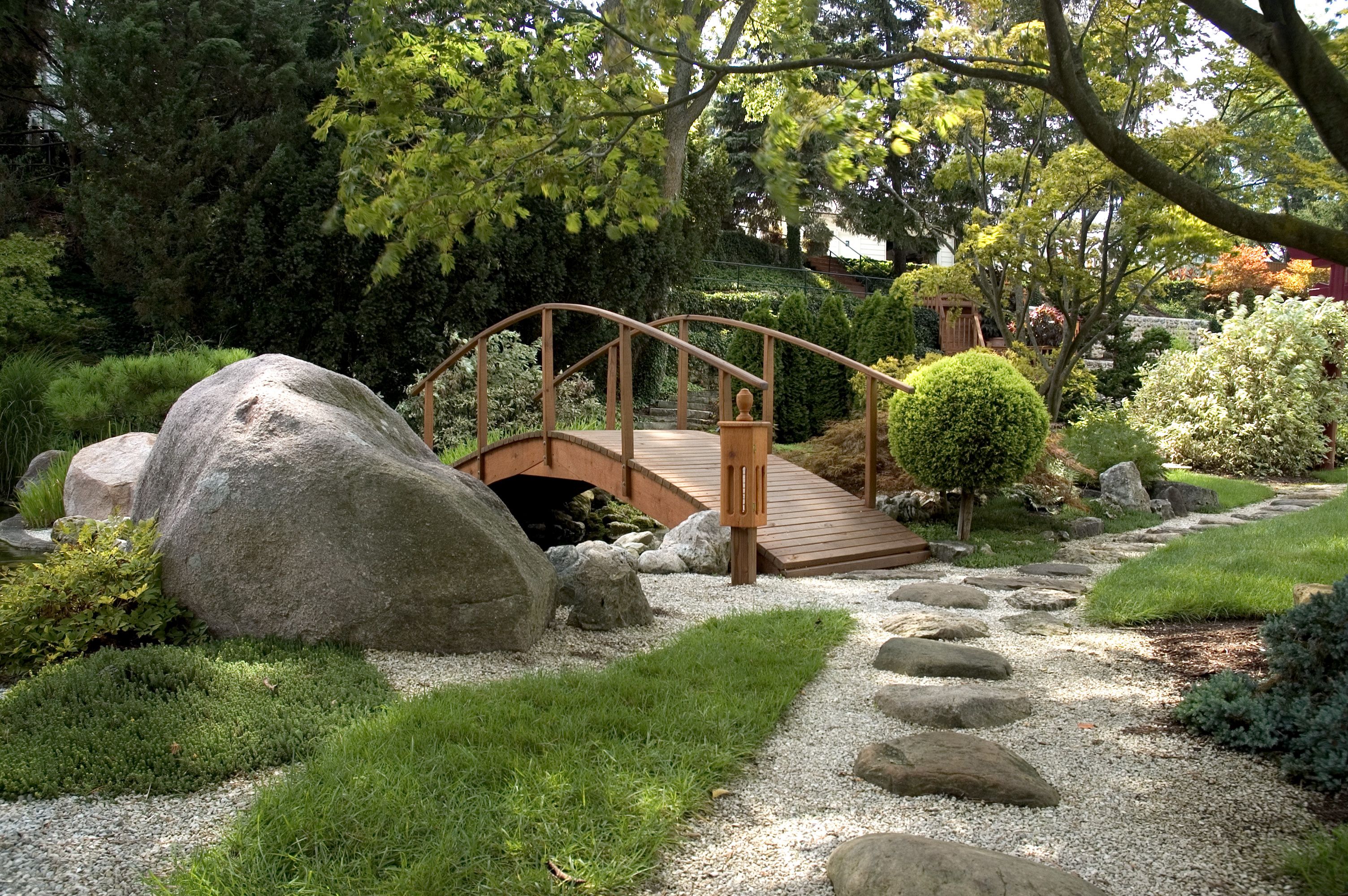Japanese garden ideas on a budget, incorporate moss and existing larger rocks