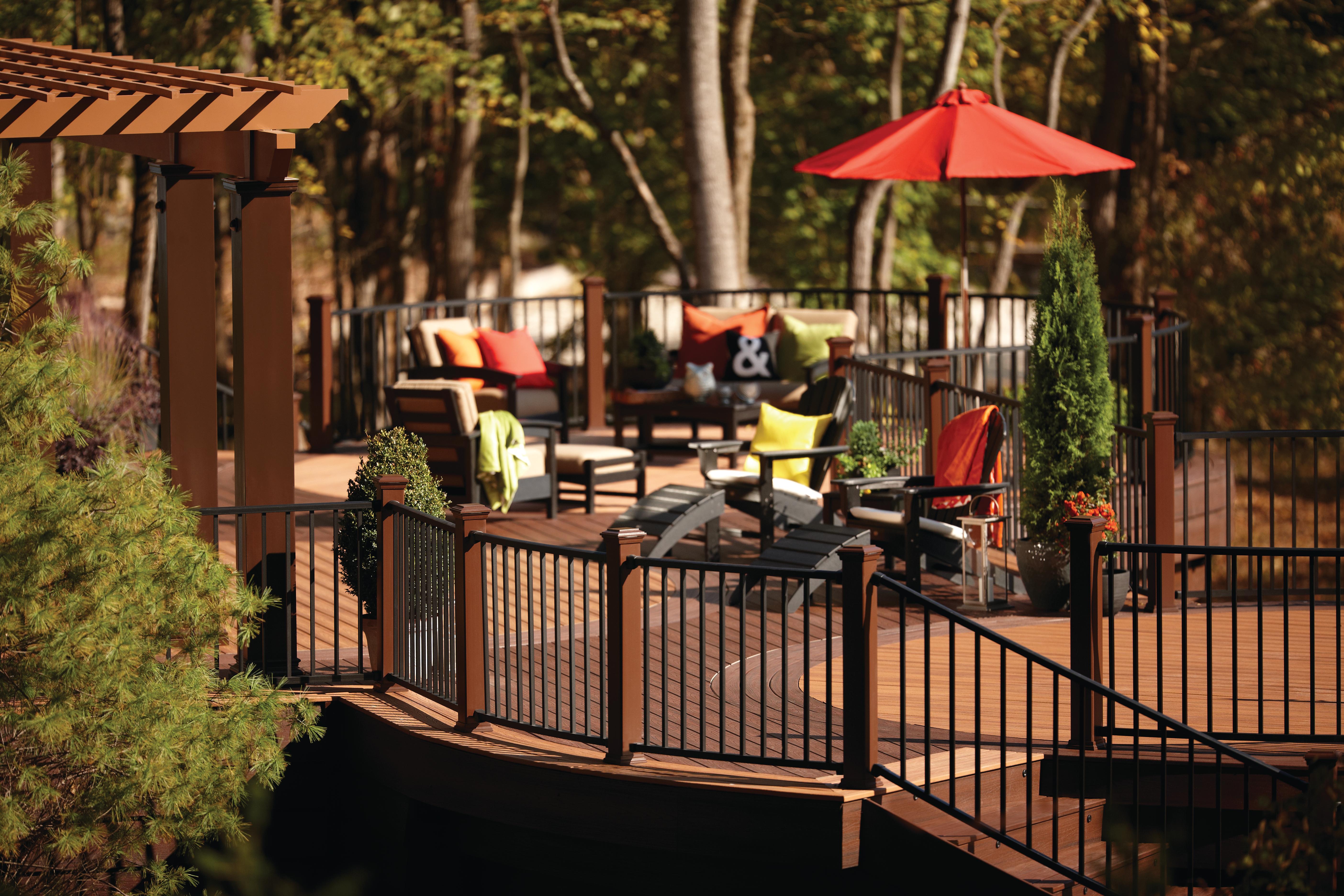 backyard deck ideas with a portable umbrella over an outdoor dining table