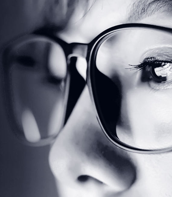 A closeup of a woman wearing glasses