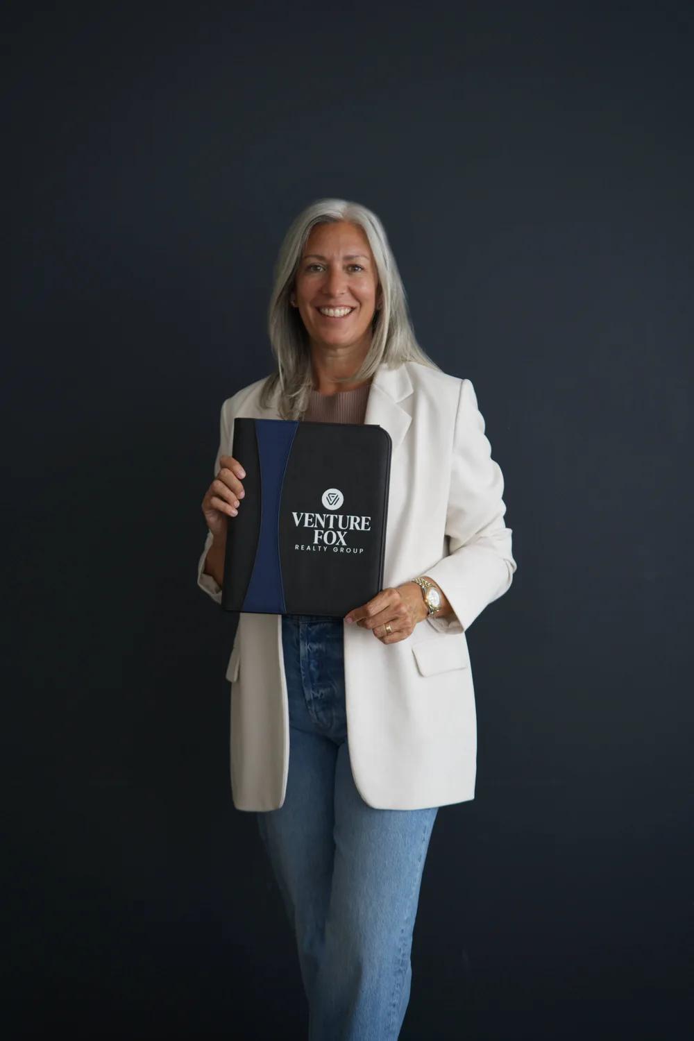 Jamie Mazuryk holding a Venture Fox folio