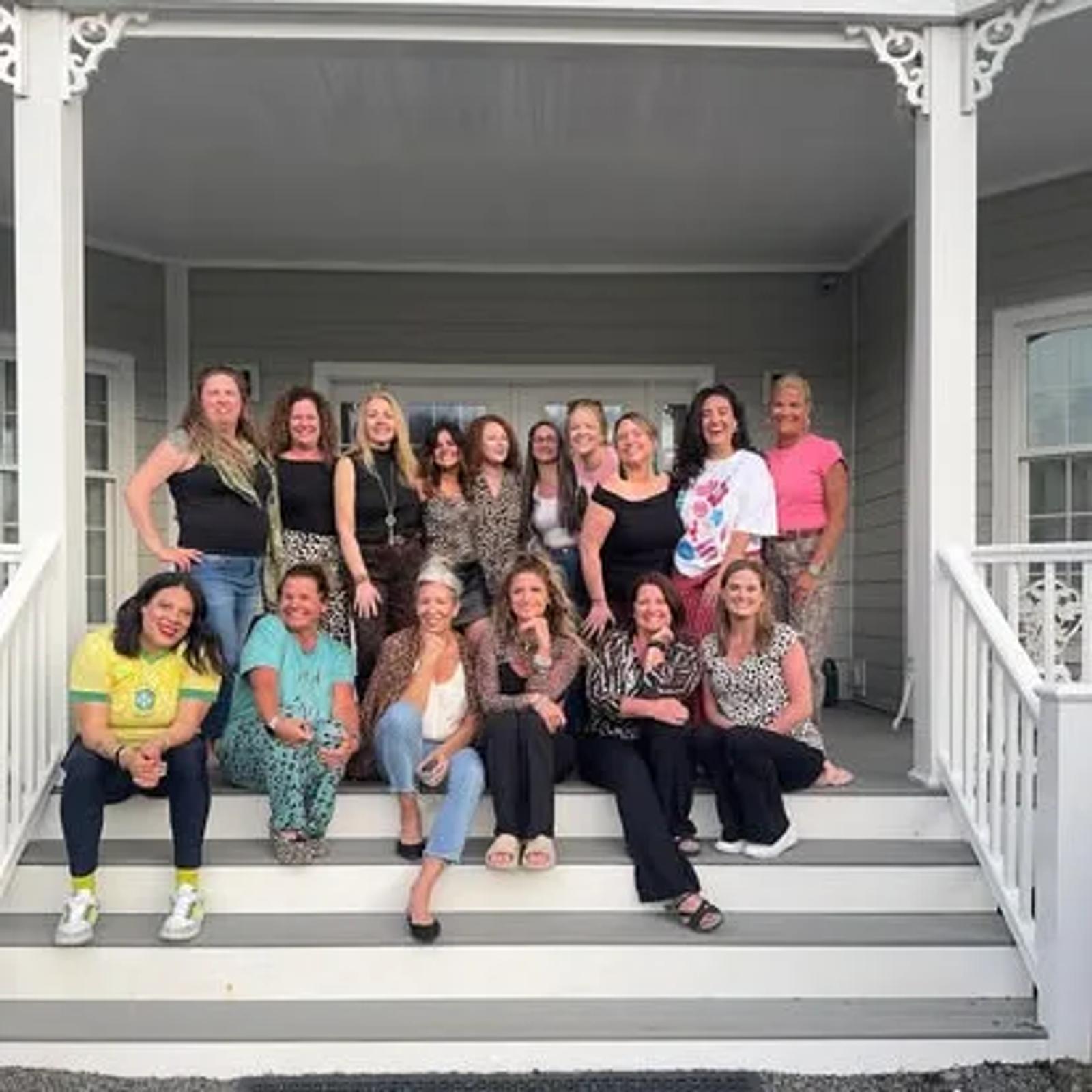 Jamie with a group of women on a porch