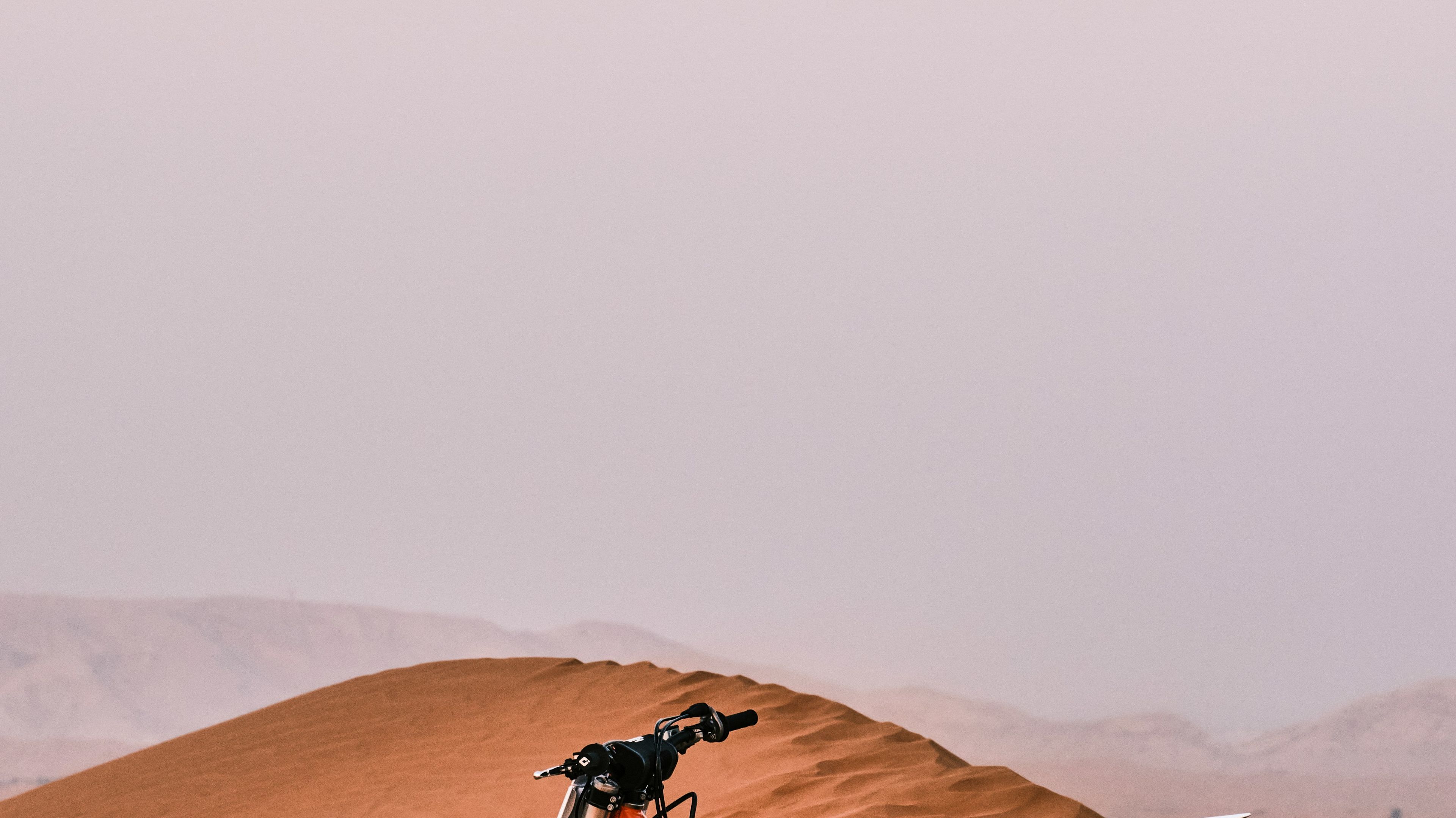 dirt bike on sand dune