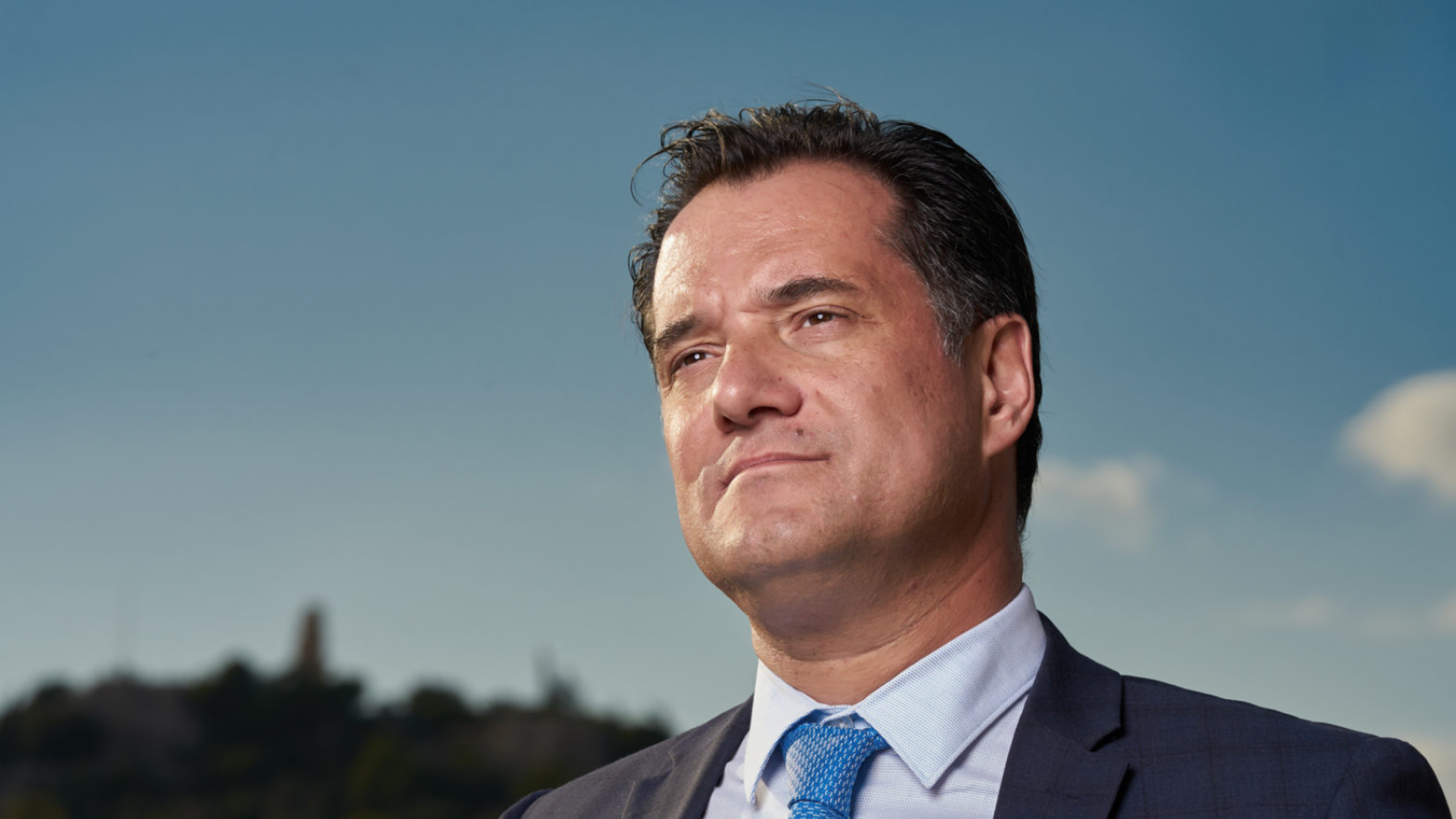 Adonis Georgiadis, Minister of Health (Greece), with the Athens skyline behind