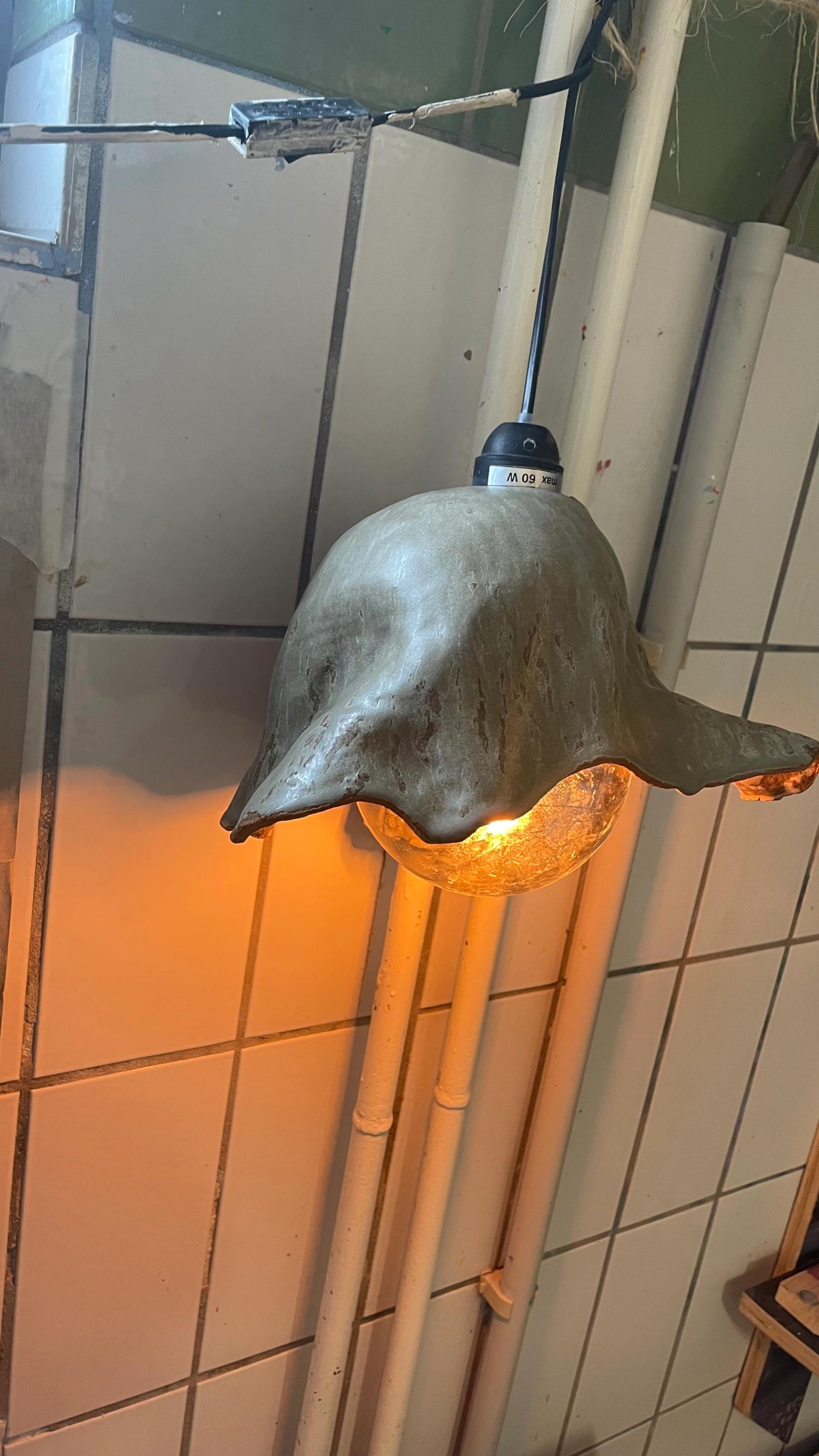 Ceramic pendant lamp with organic drooping form