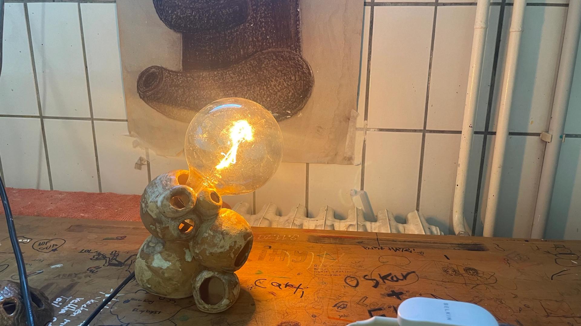 Sculptural ceramic lamp with organic form and Edison bulb