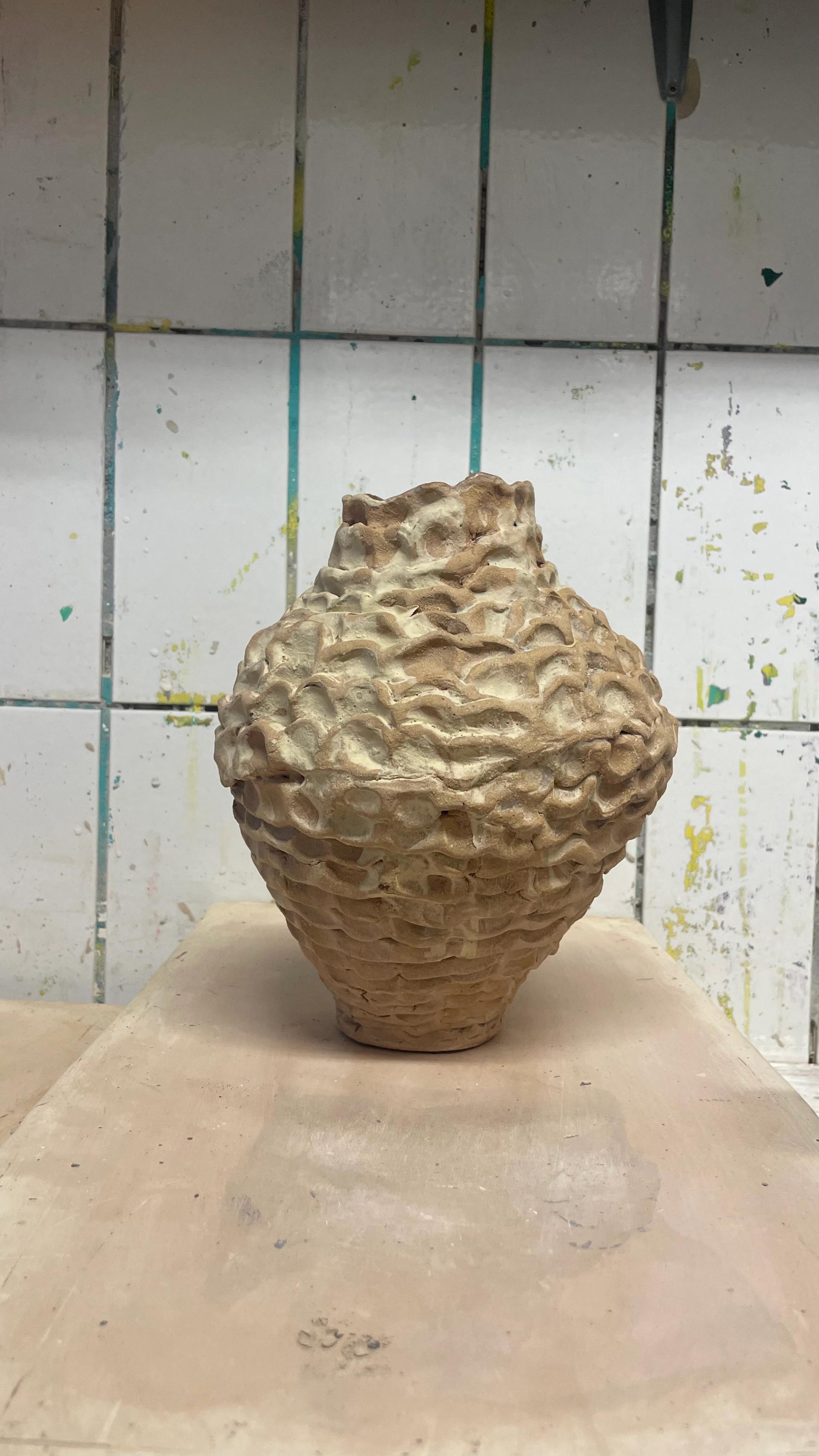 Textured ceramic vessel with wavy surface