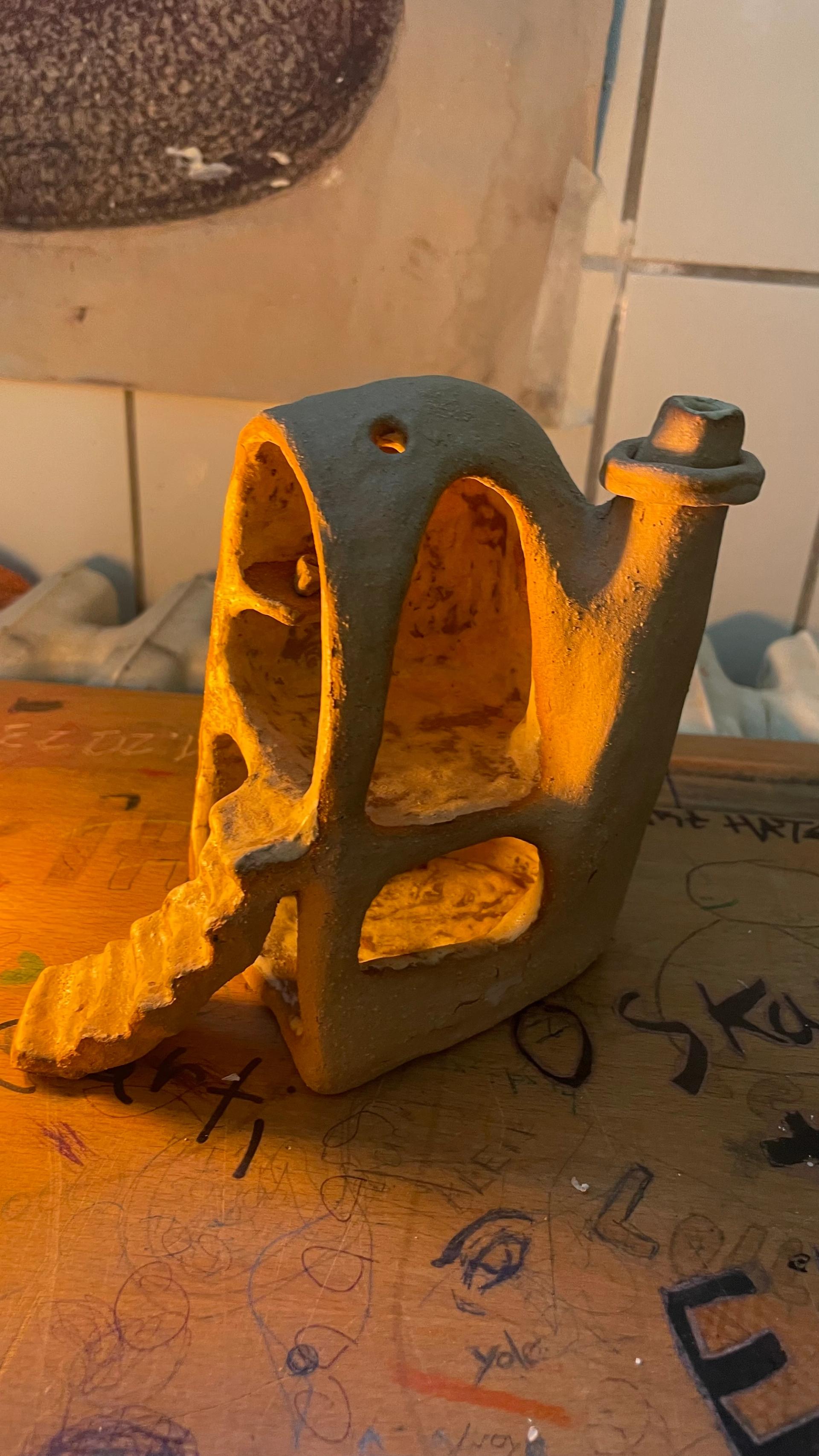 Sculptural ceramic piece with architectural cutouts