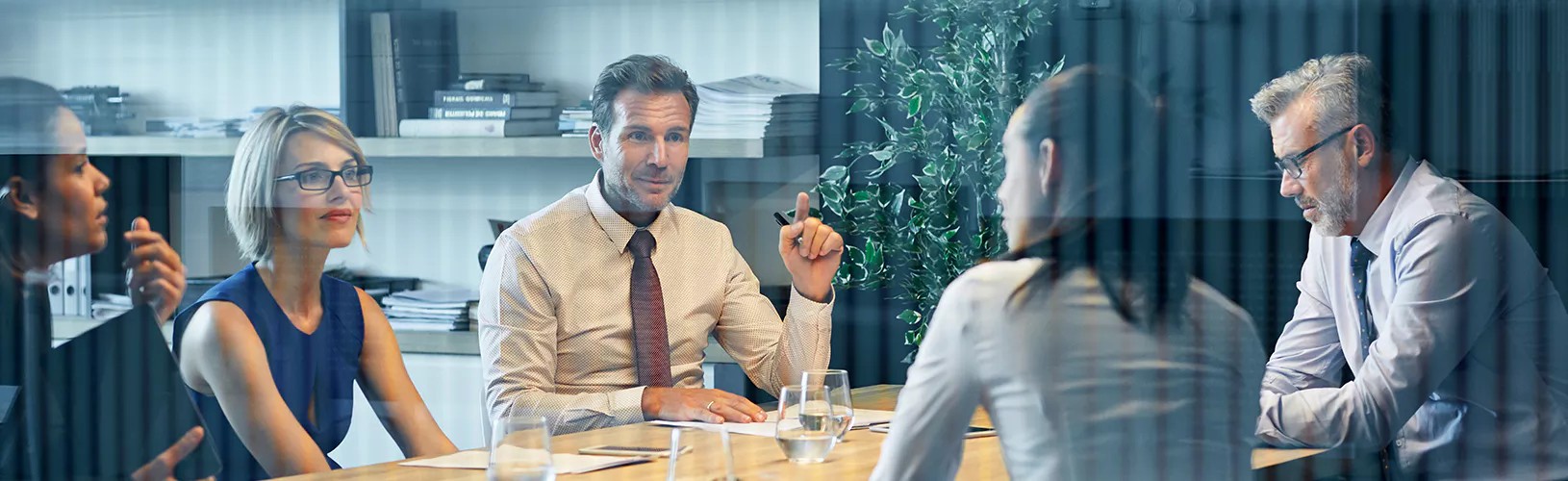 Professionals discussing their third-party risk management audit program.