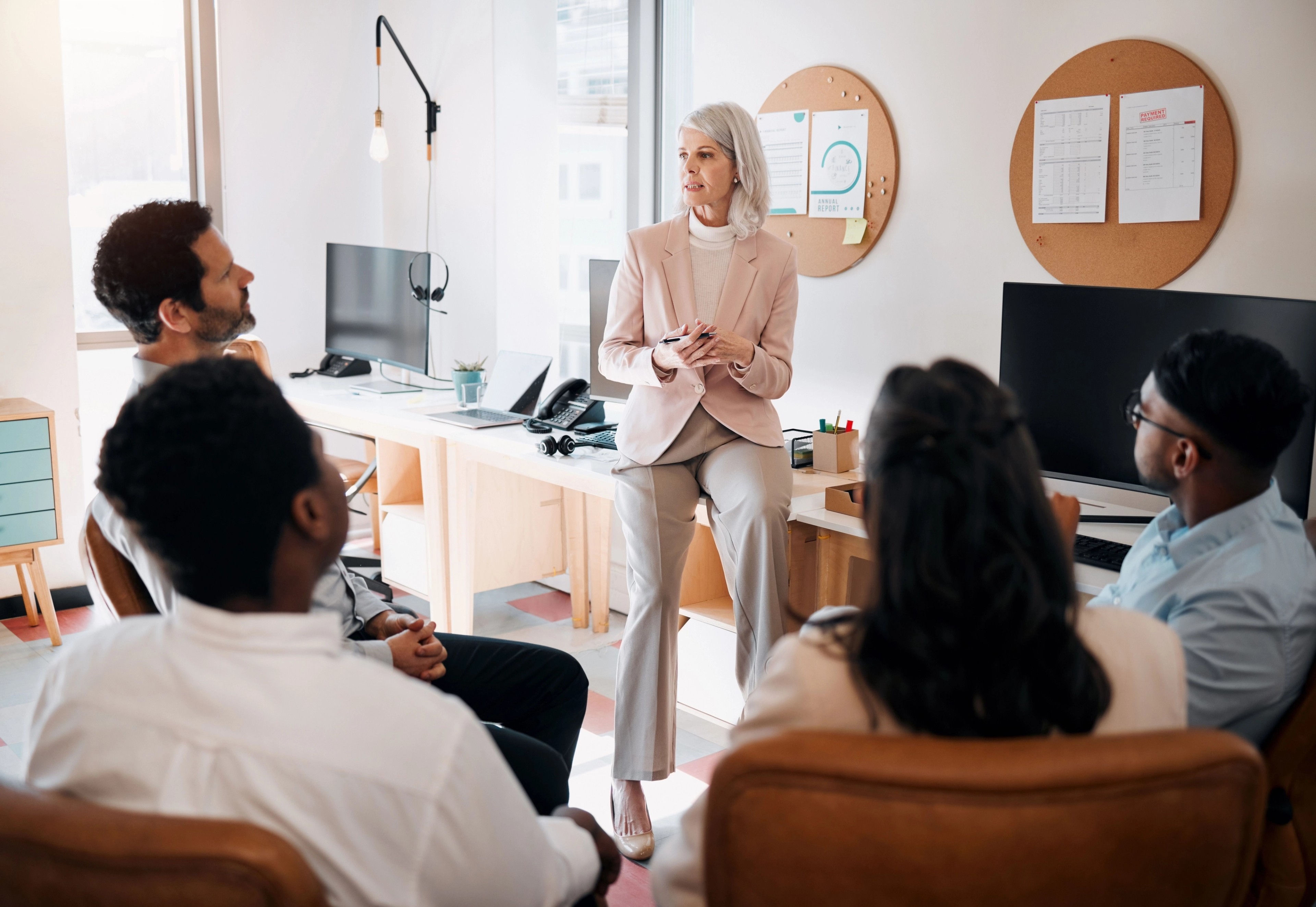 businesswoman addressing a room of people