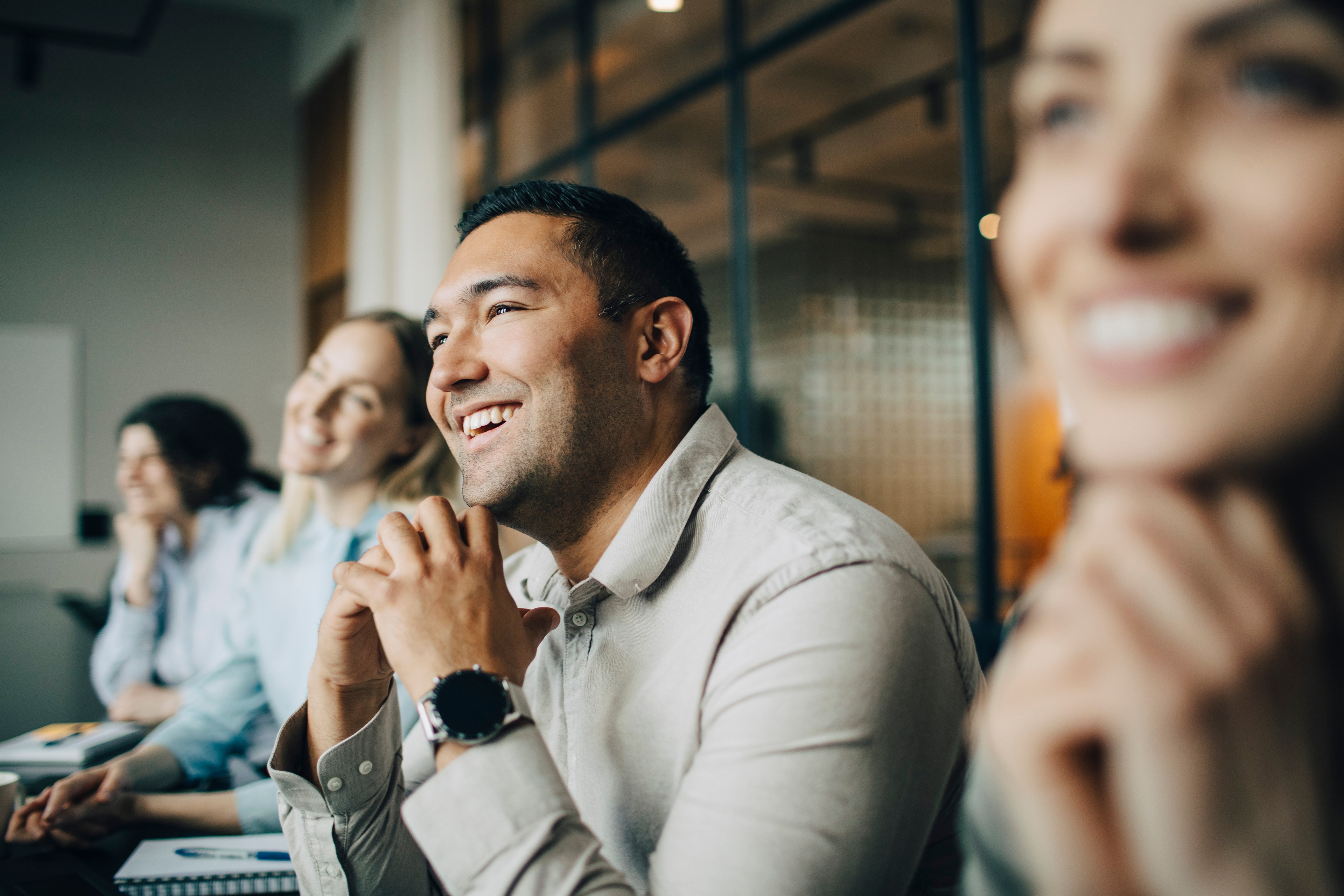 Employees discussing how to safeguard customer data during Data Privacy Week