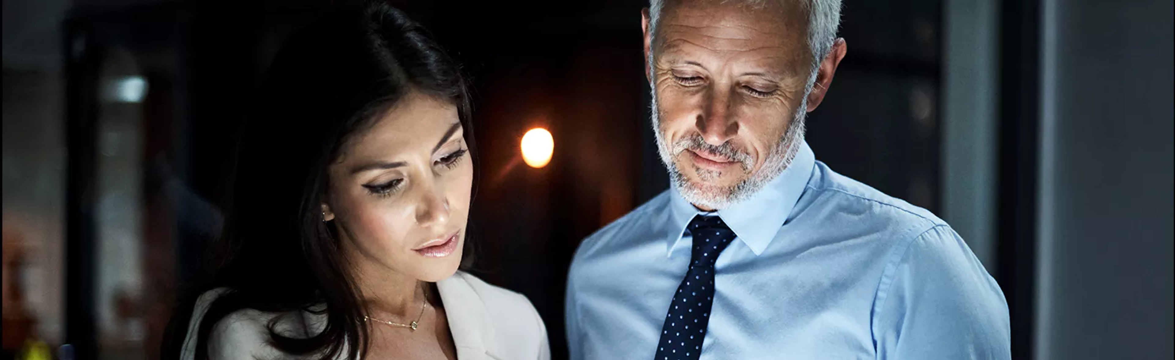 Two colleagues discussing regulatory intelligence