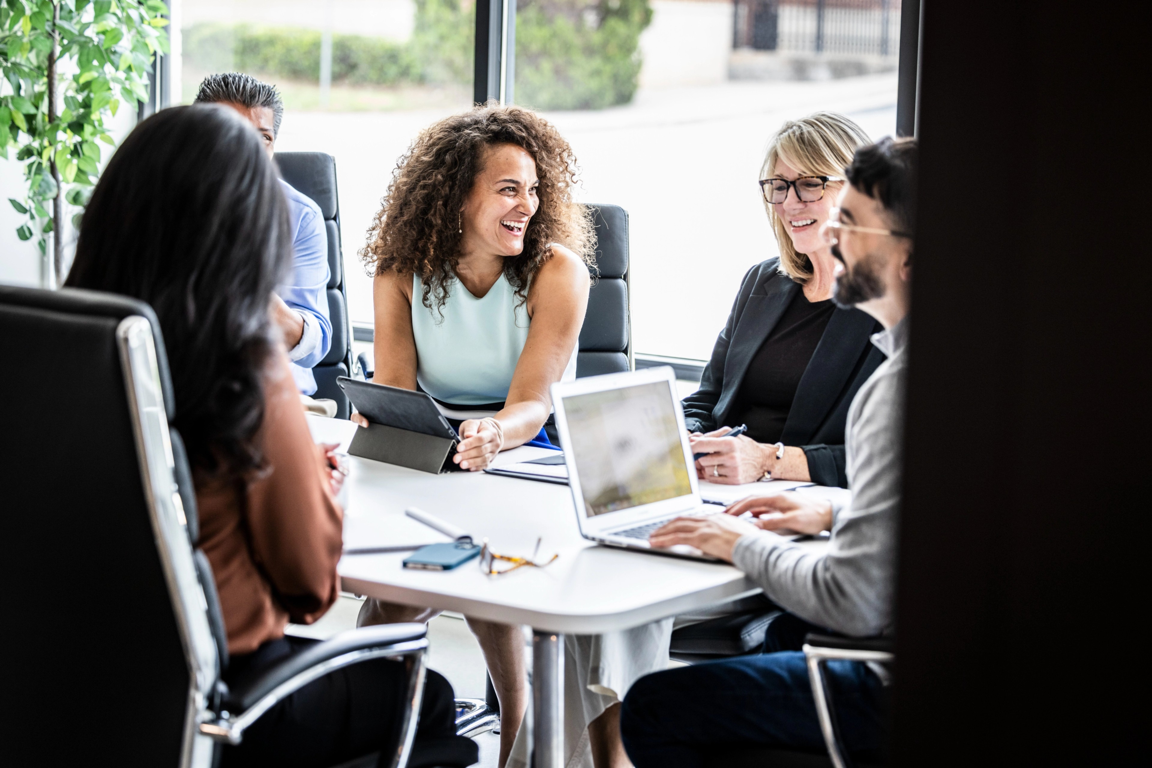 Professionals discussing their successful implementation of Diligent Boards.