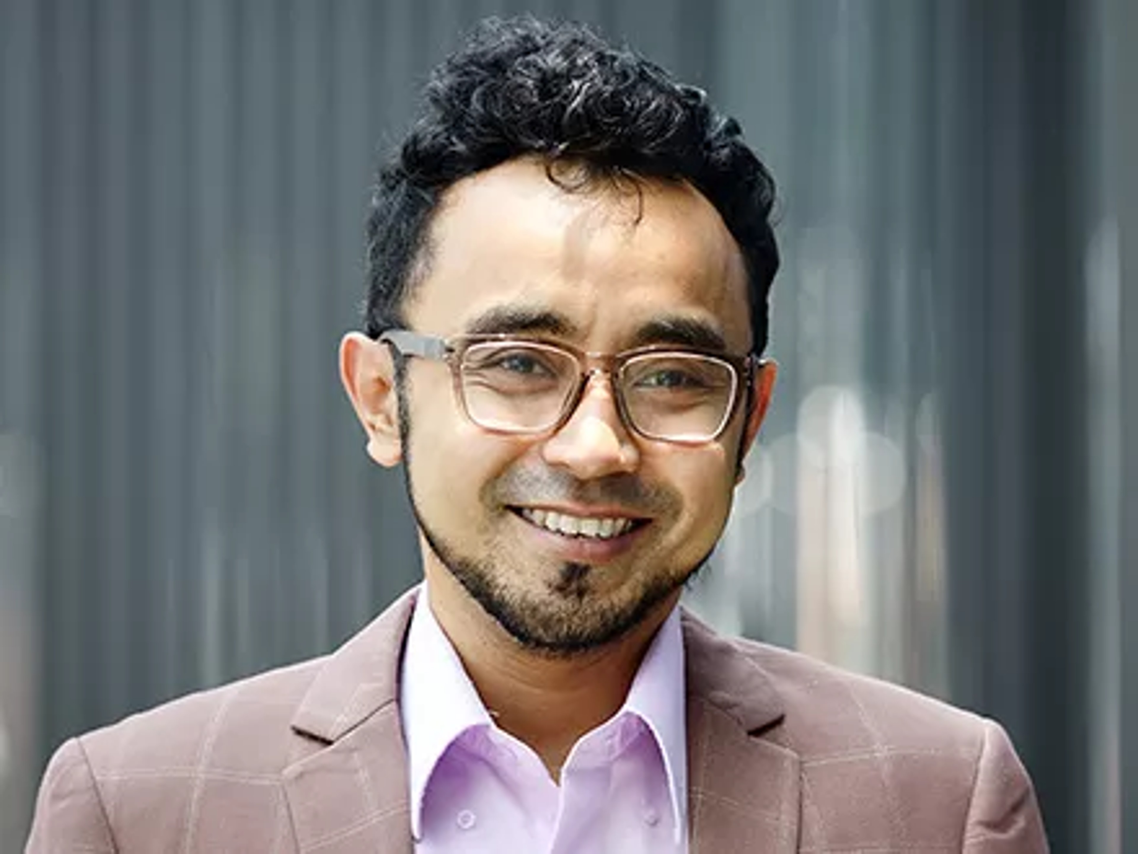 eGRC professional smiling at camera