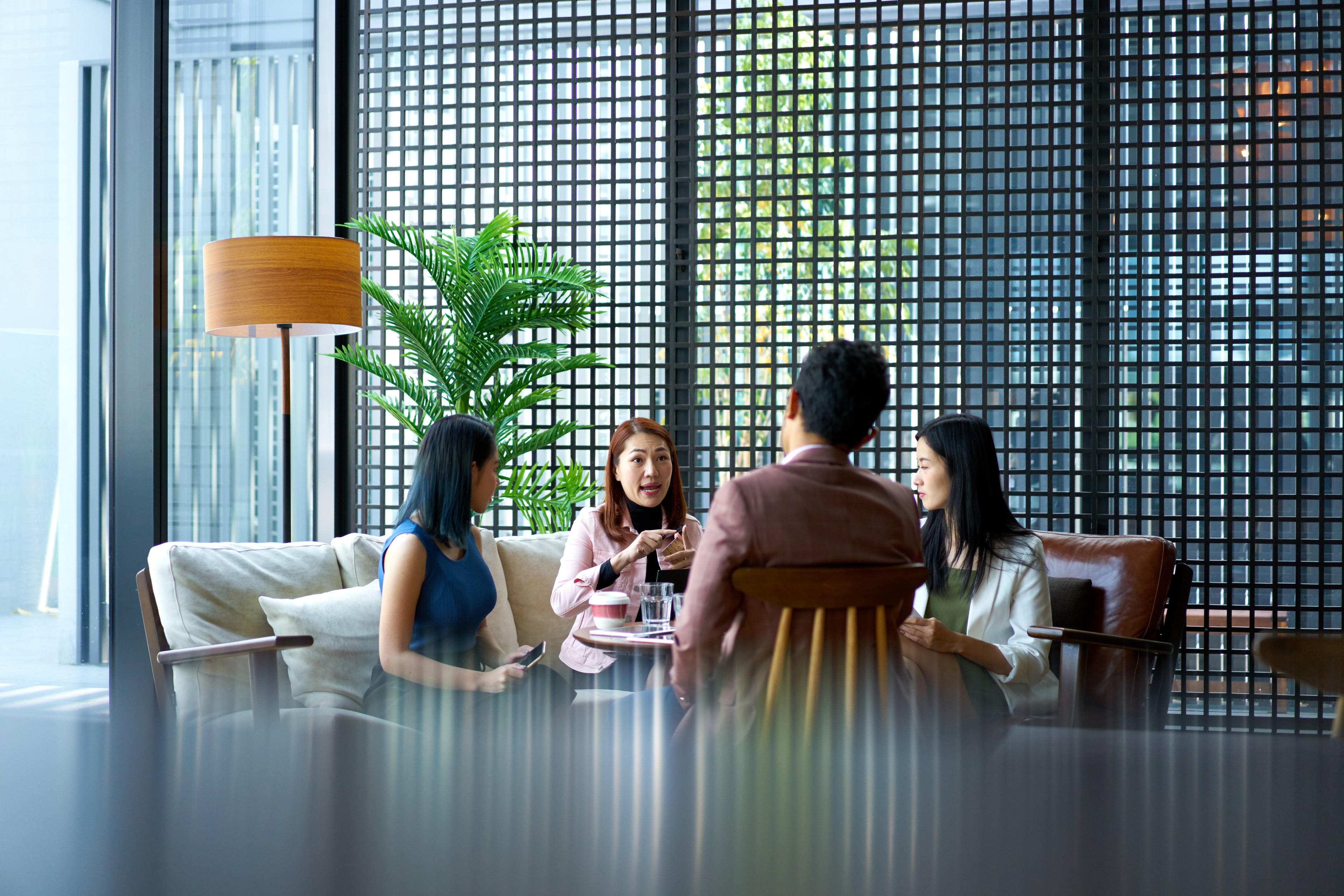 Professionals discussing the implications of AI on business