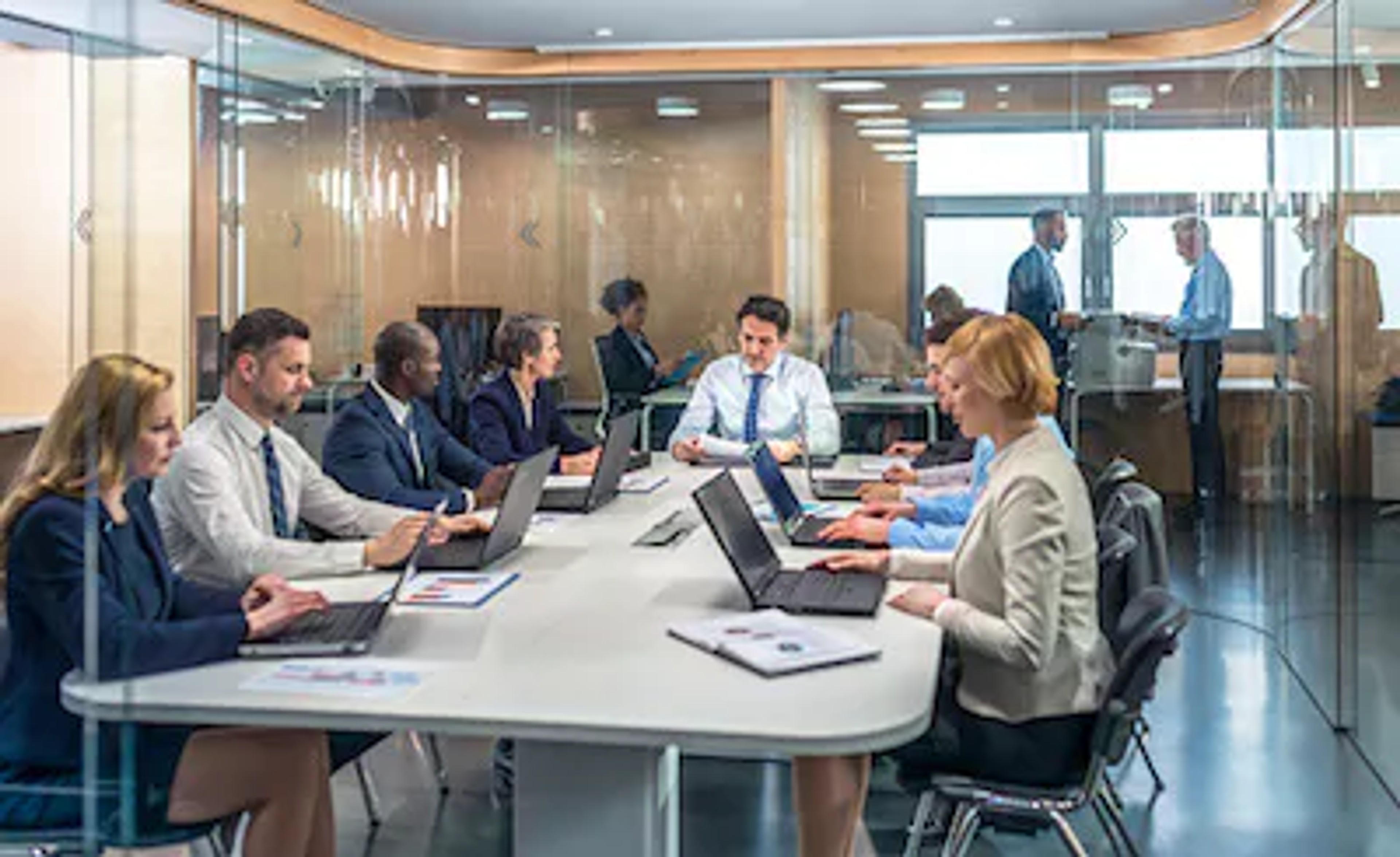 Person writing a motion within a board meeting