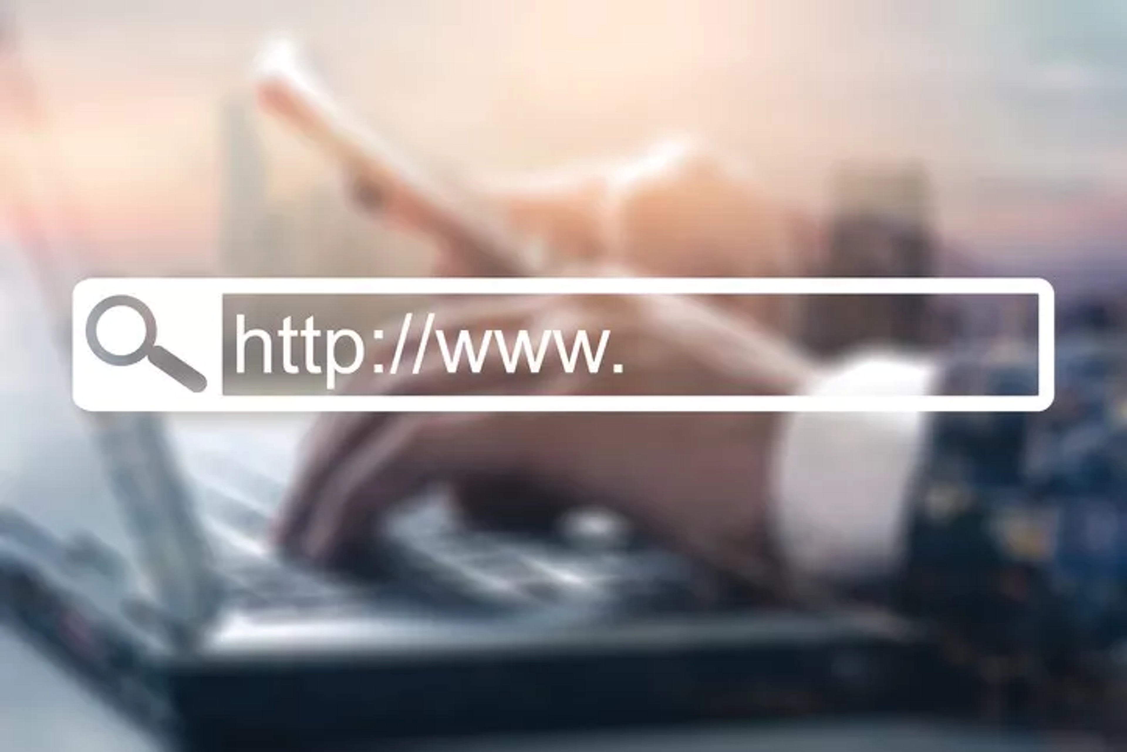 A professional typing on a laptop signifying the importance of an effective government website.