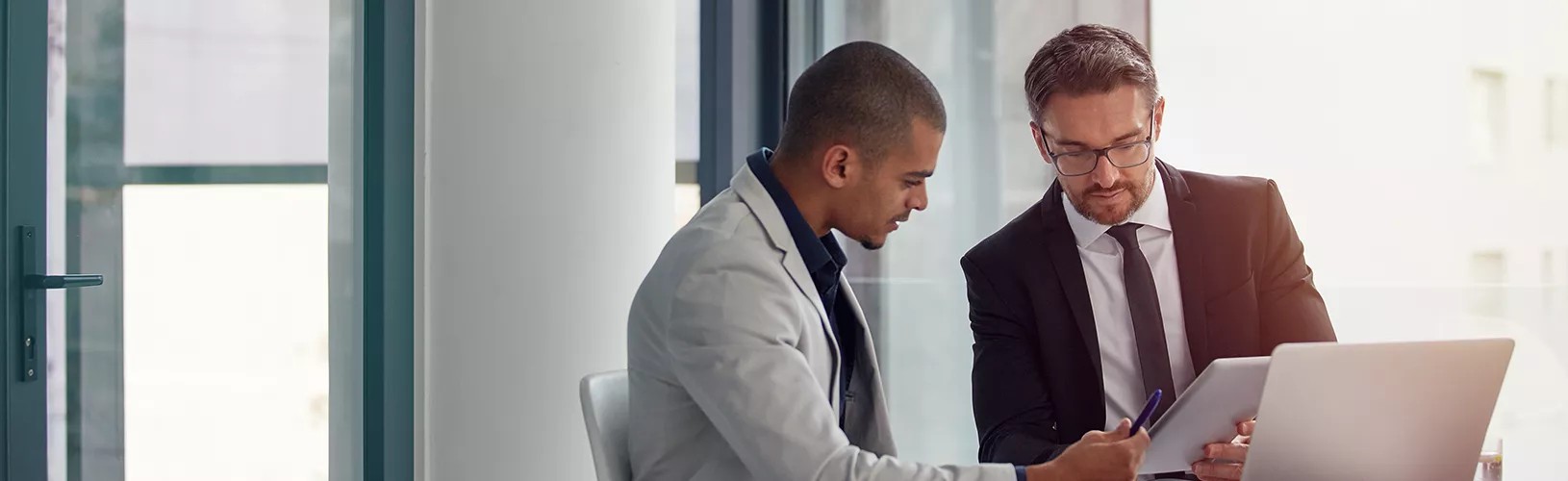 Two people discussing the entities ROI calculator