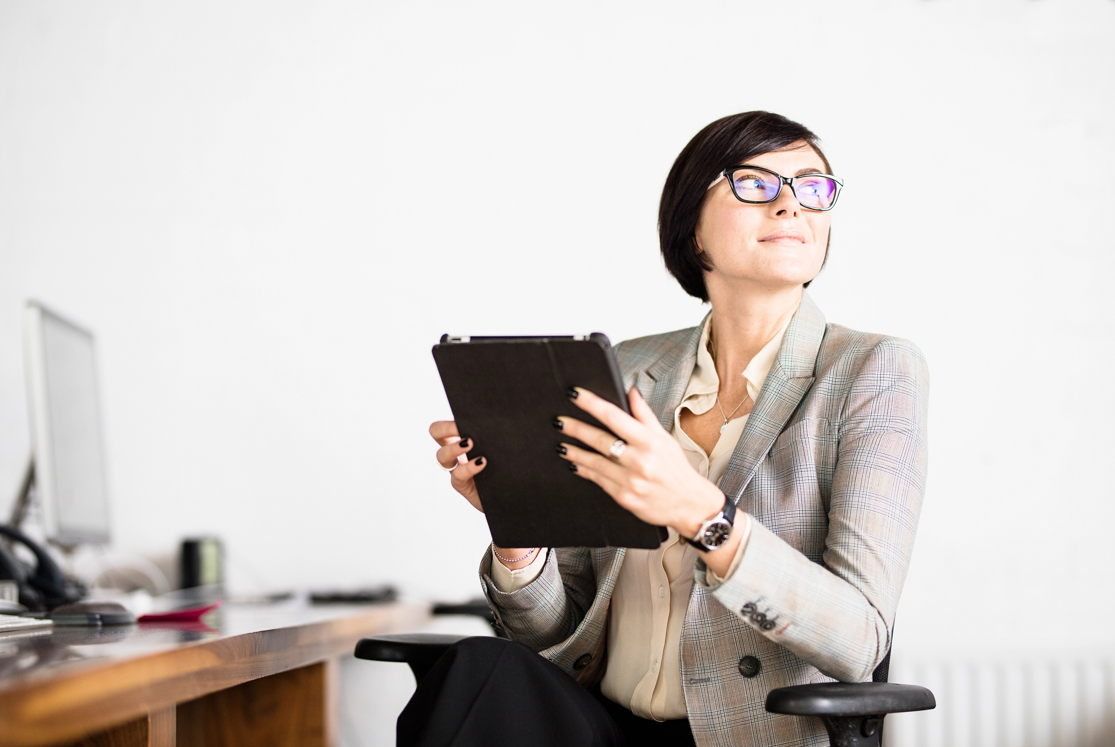 Businesswoman working with tablet PC in office