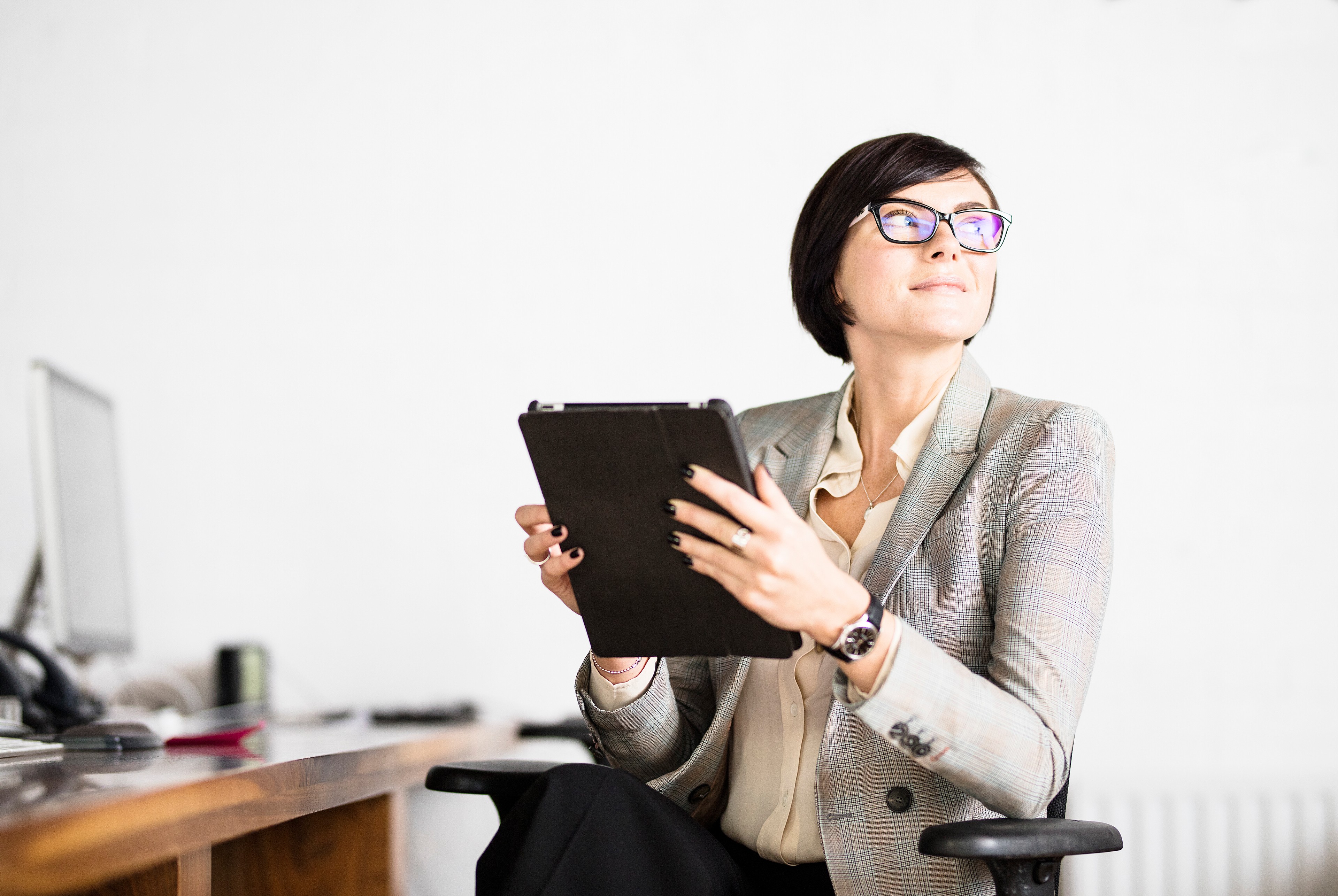 Businesswoman working with tablet PC in office