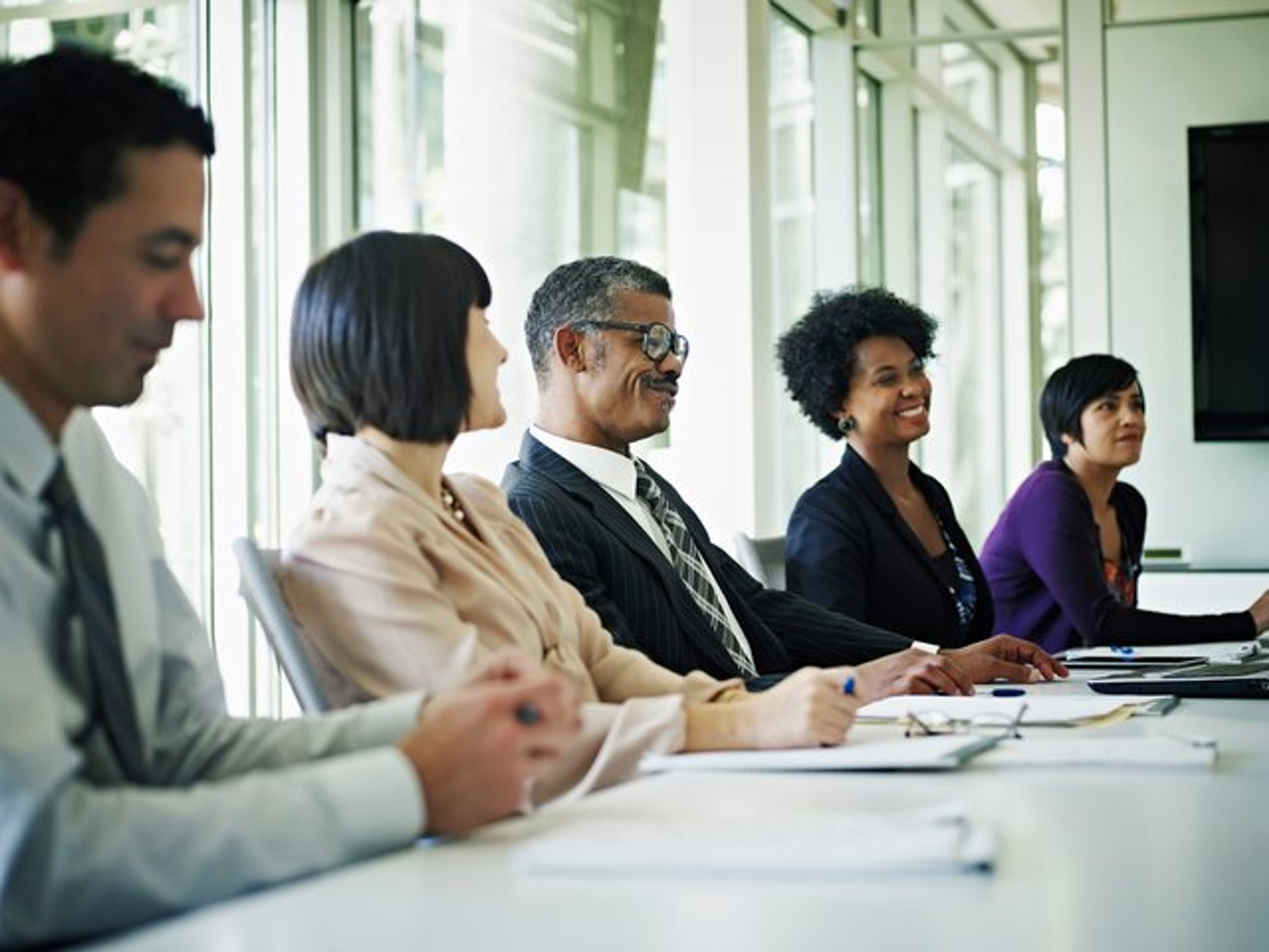A board chair speaking during an executive board meeting