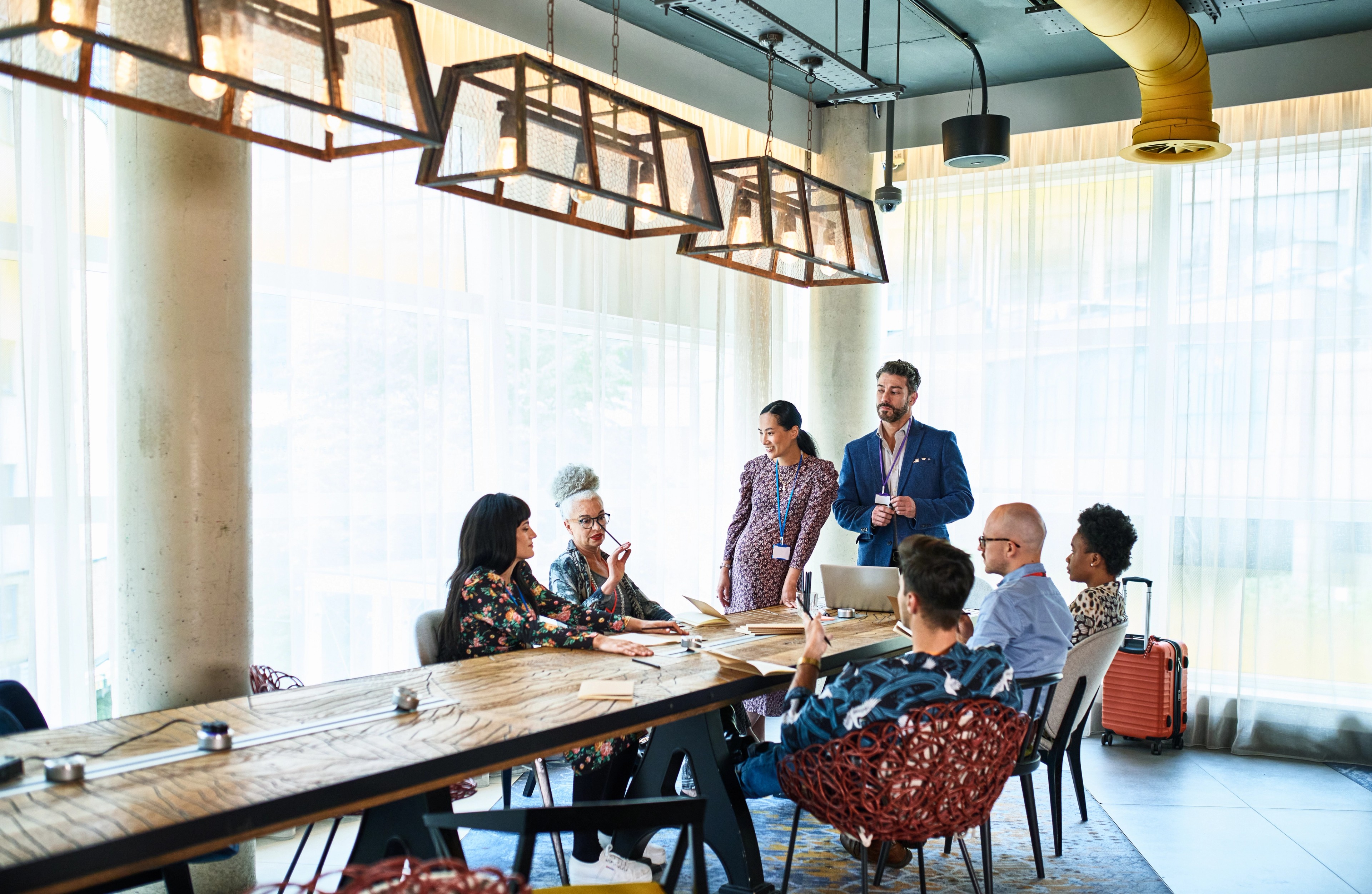 Diverse multi racial business colleagues at meeting table