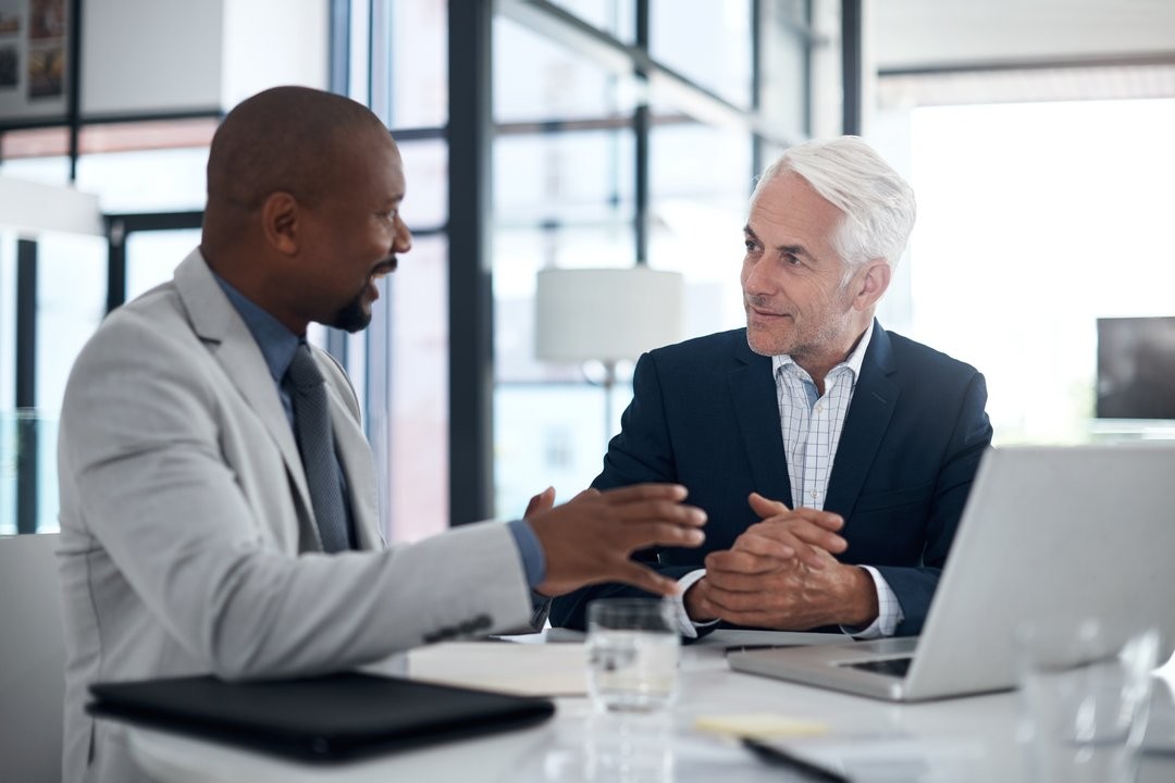 Two people discussing the ITIL framework