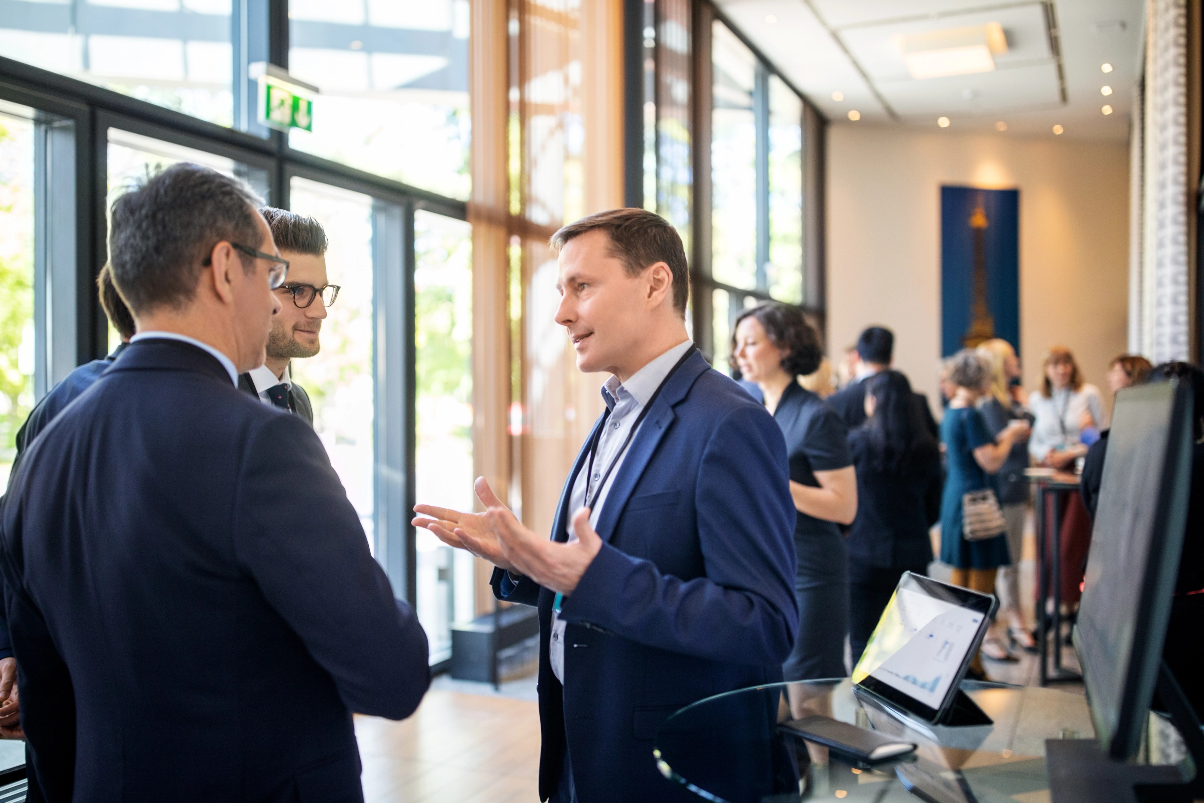 Professionals discussing key takeaways of IIA International 2024