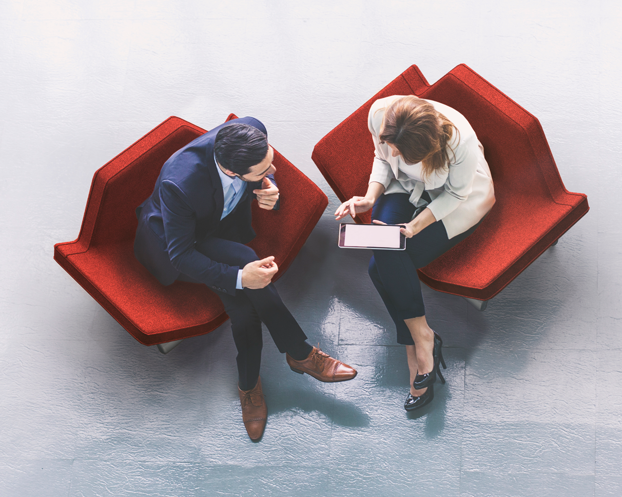 overhead image of business people review digital content
