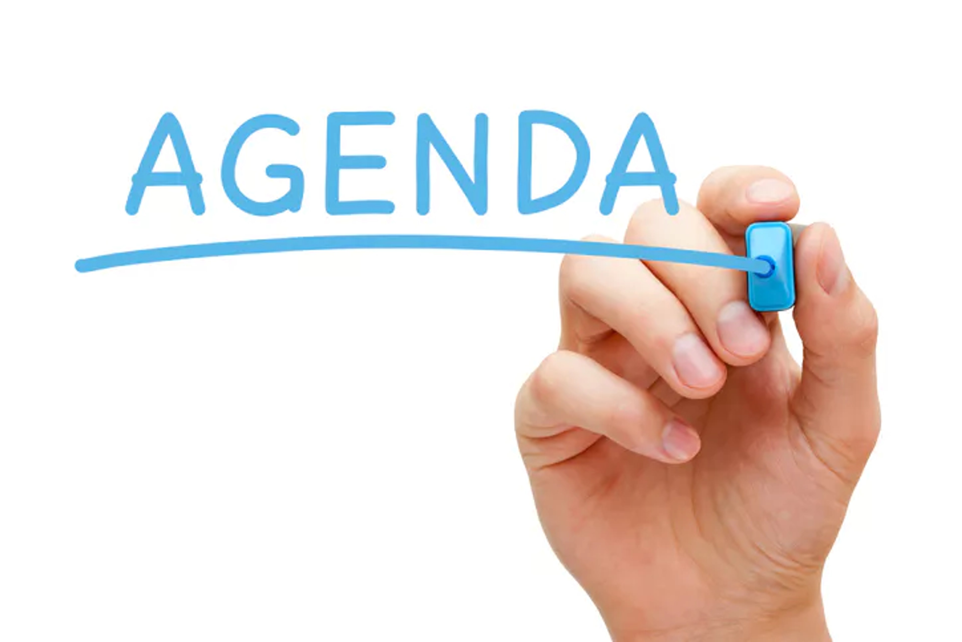 Person has written 'agenda' to signify a school board meeting agenda template.