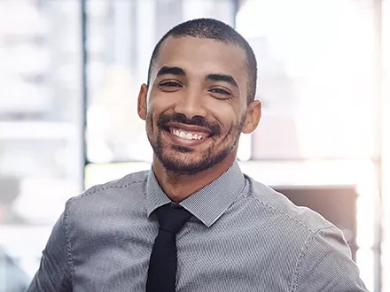 A finance professional considering the benefits of sustainable finance.