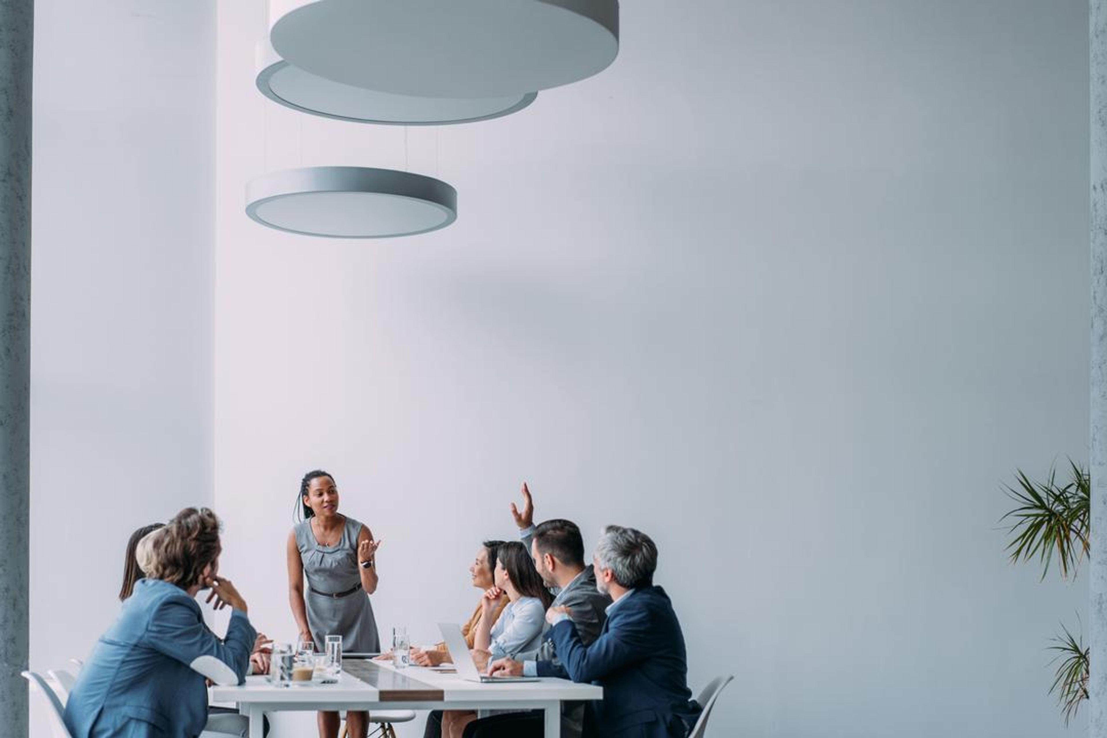 Colleagues discussing the best due diligence software for their company