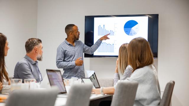 Board members using Diligent's board portal software