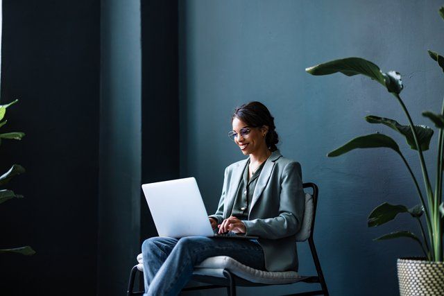 A compliance officer reading the guide on how to stop money laundering with due diligence