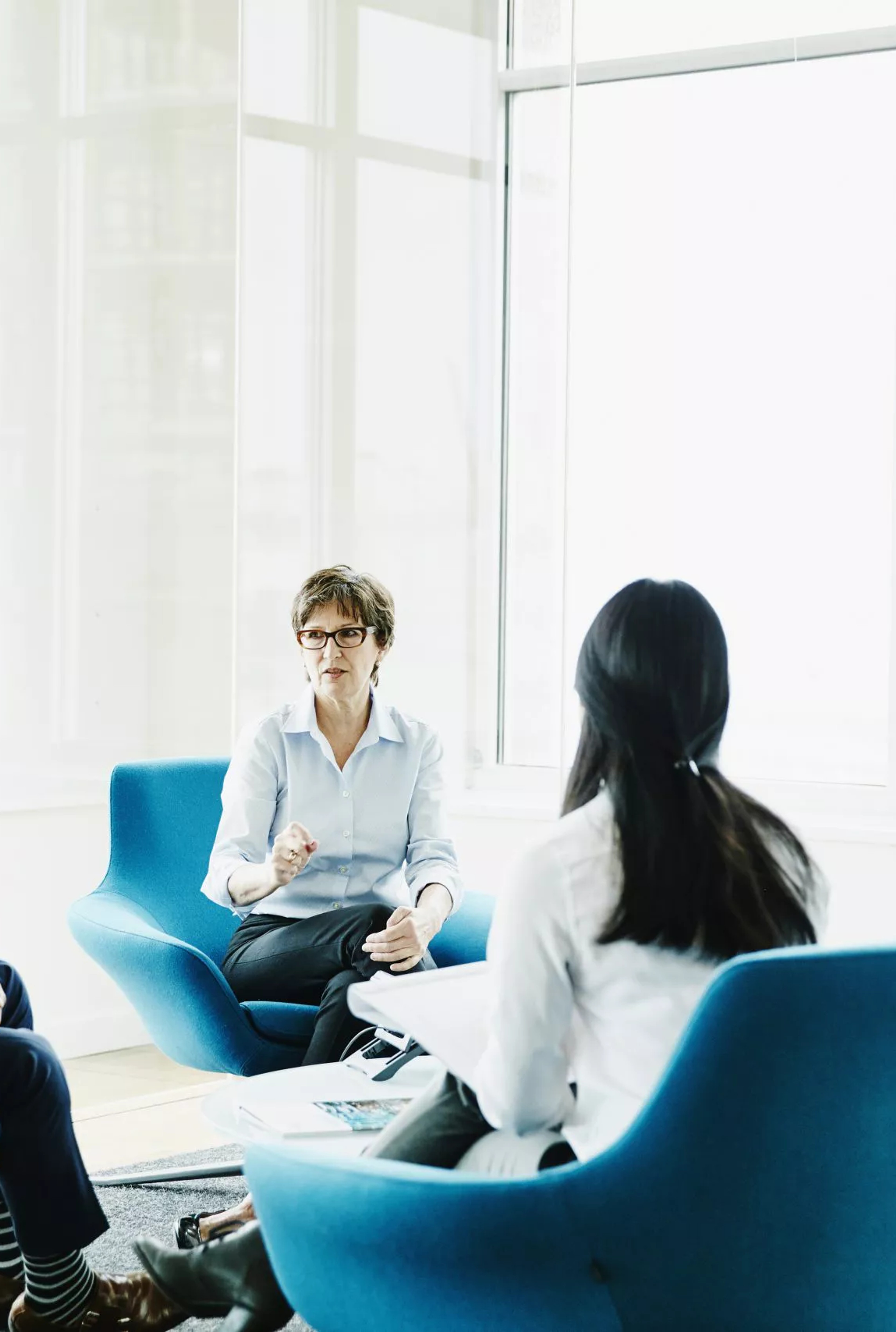 Four people sat down having a meeting