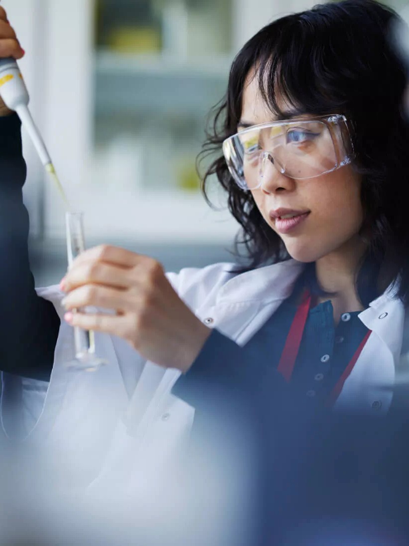 Young Female Scientist Working in a Lab