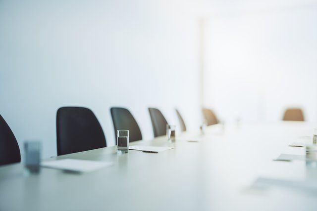 A boardroom where Diligent helps with DORA and Cybersecurity