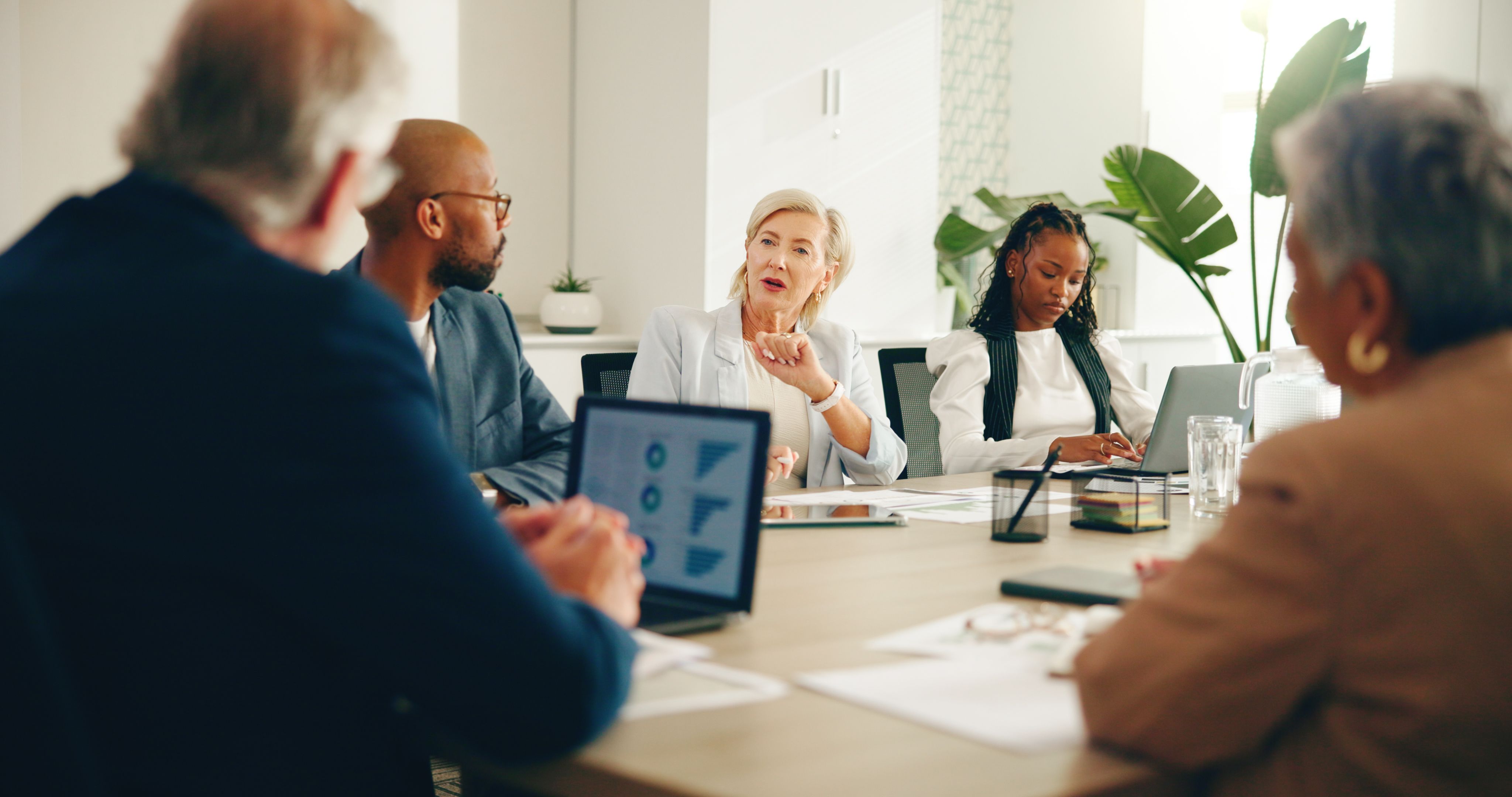 group of people in a meeting discussing cis compliance