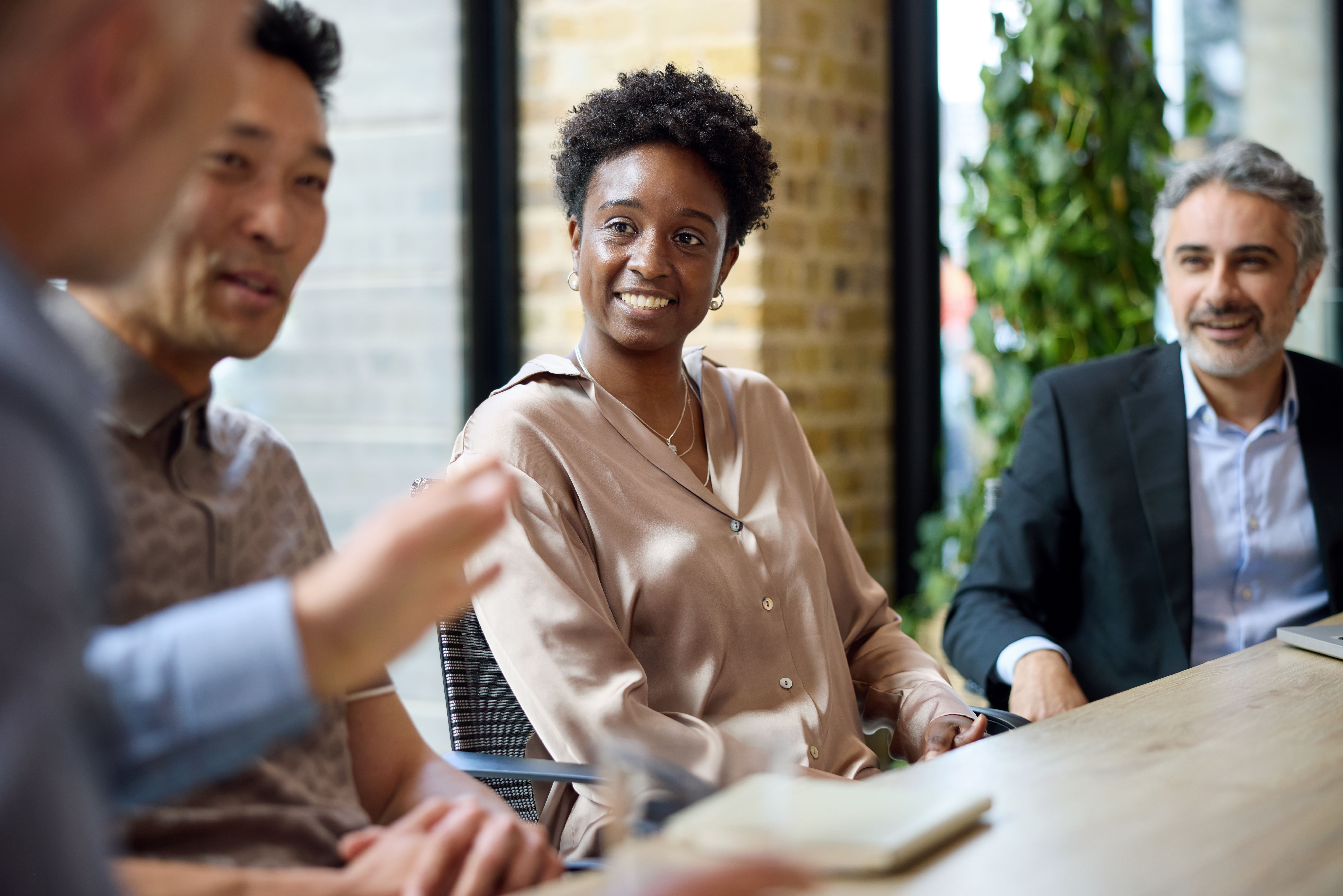 group of people discussing compliance automation software