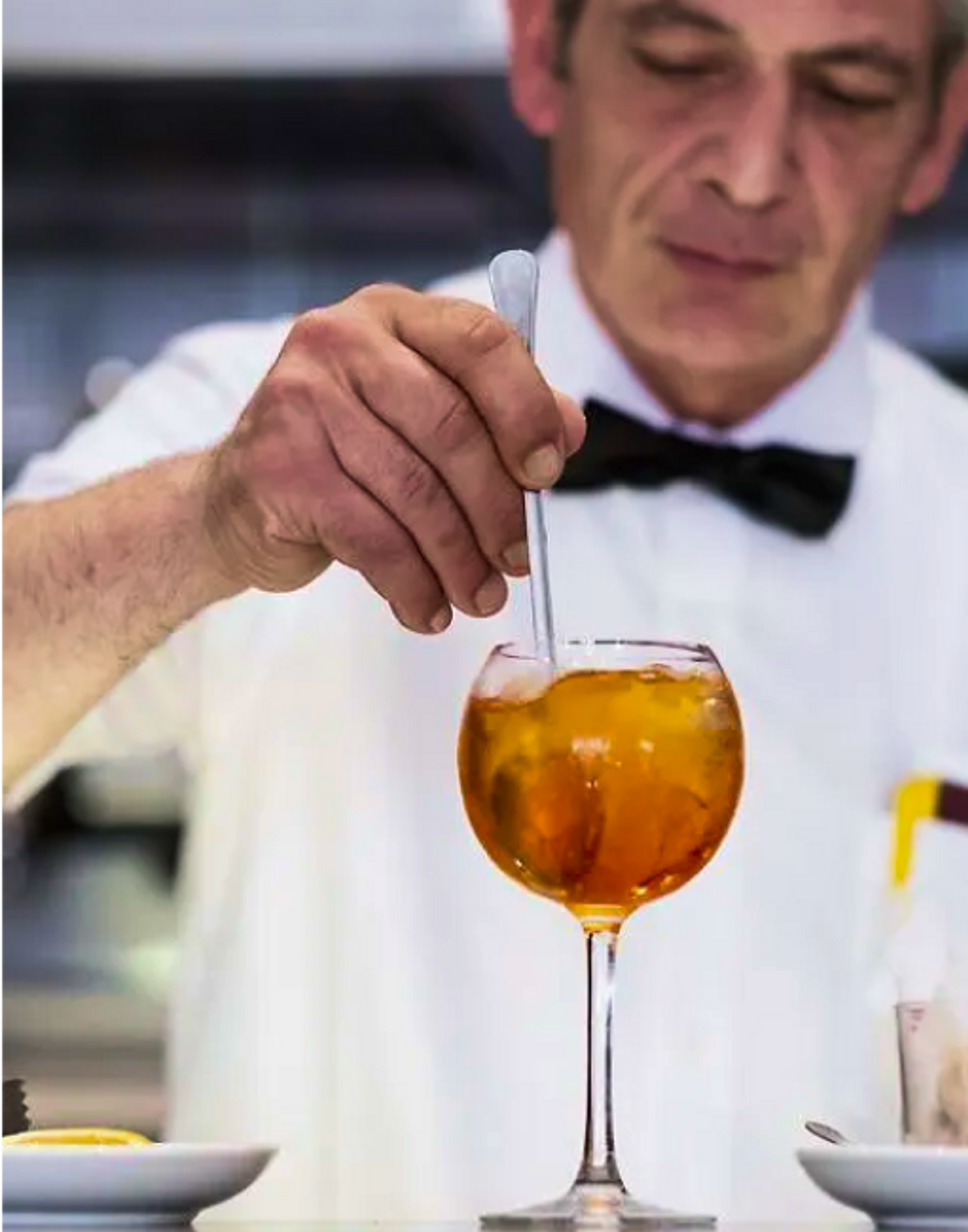 Person making a cocktail