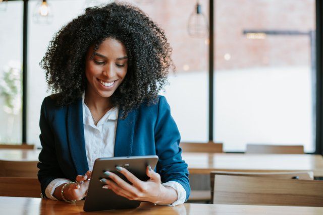 A risk officer reading a guide on ERM software to help her with corporate risk management