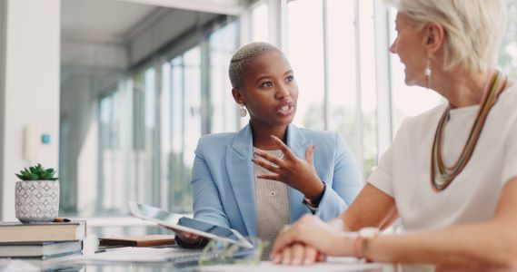 woman-with-tablet-in-office-meeting