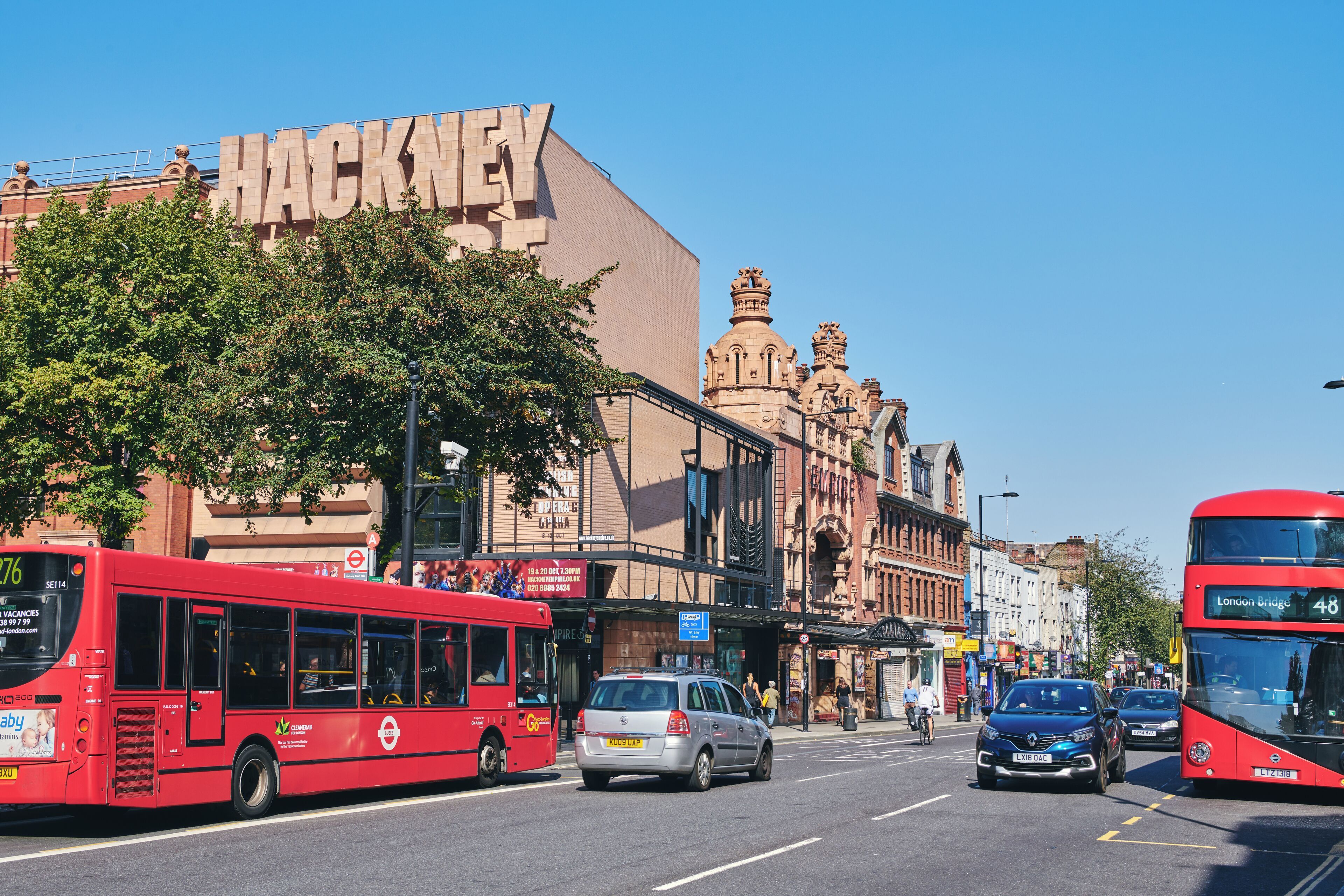 Red London buses on Mare Street in Hackney Central