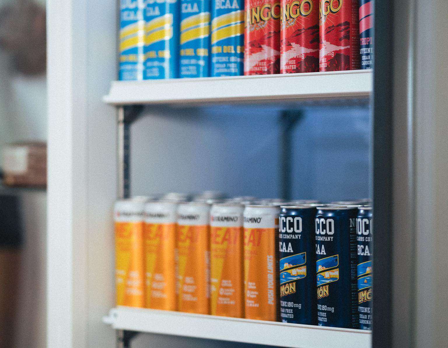 Shelves of BCAA and protein drinks on the supplement rack at Fit This