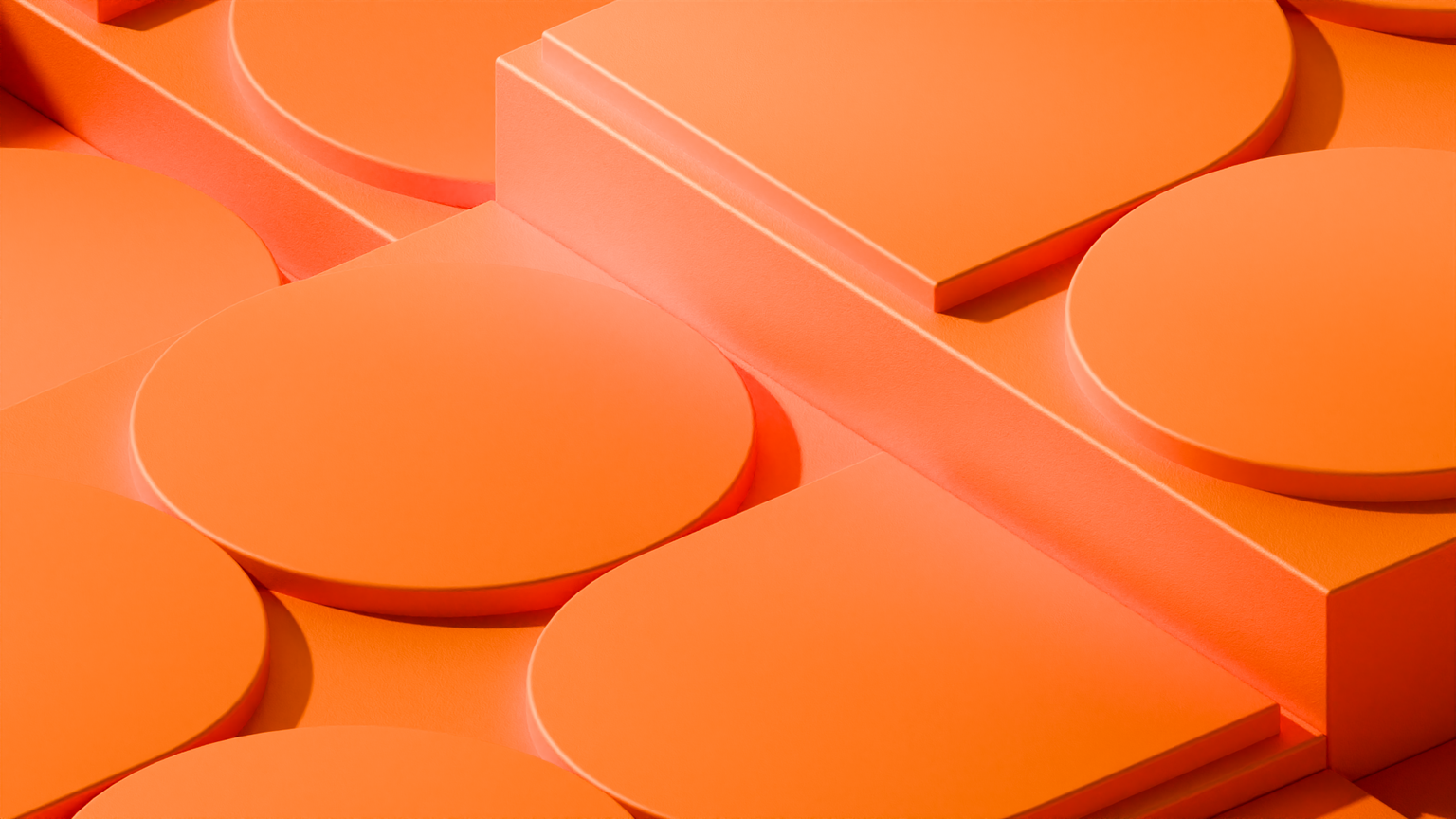 Close-up of an orange 3D geometric pattern featuring circular and rectangular raised shapes arranged in a grid representing Ory Kratos.