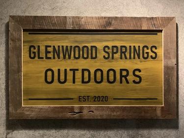 Sign outside front door that reads Glenwood Springs Outdoors