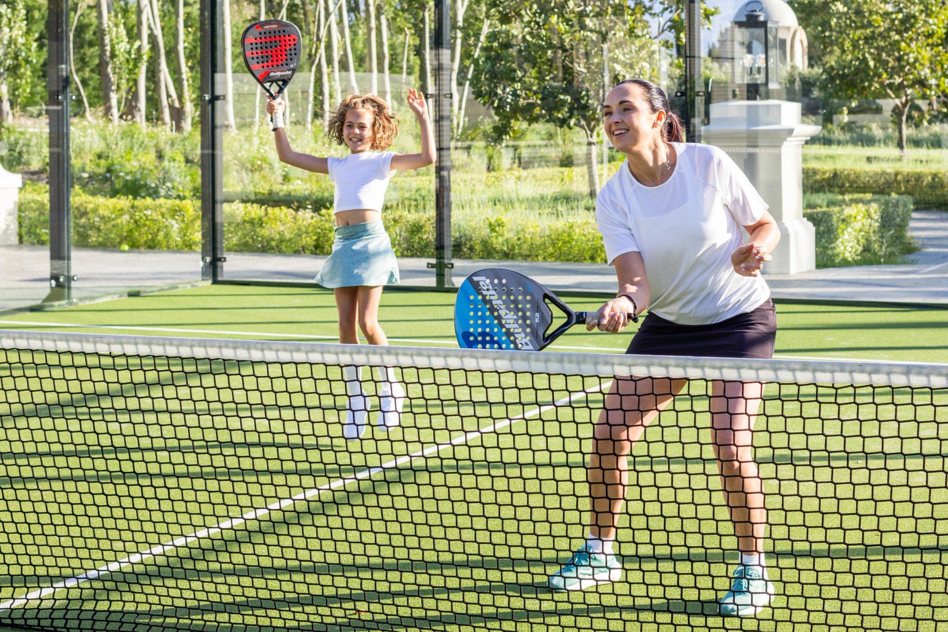 Our guests enjoying the beautiful padel courts for a family game