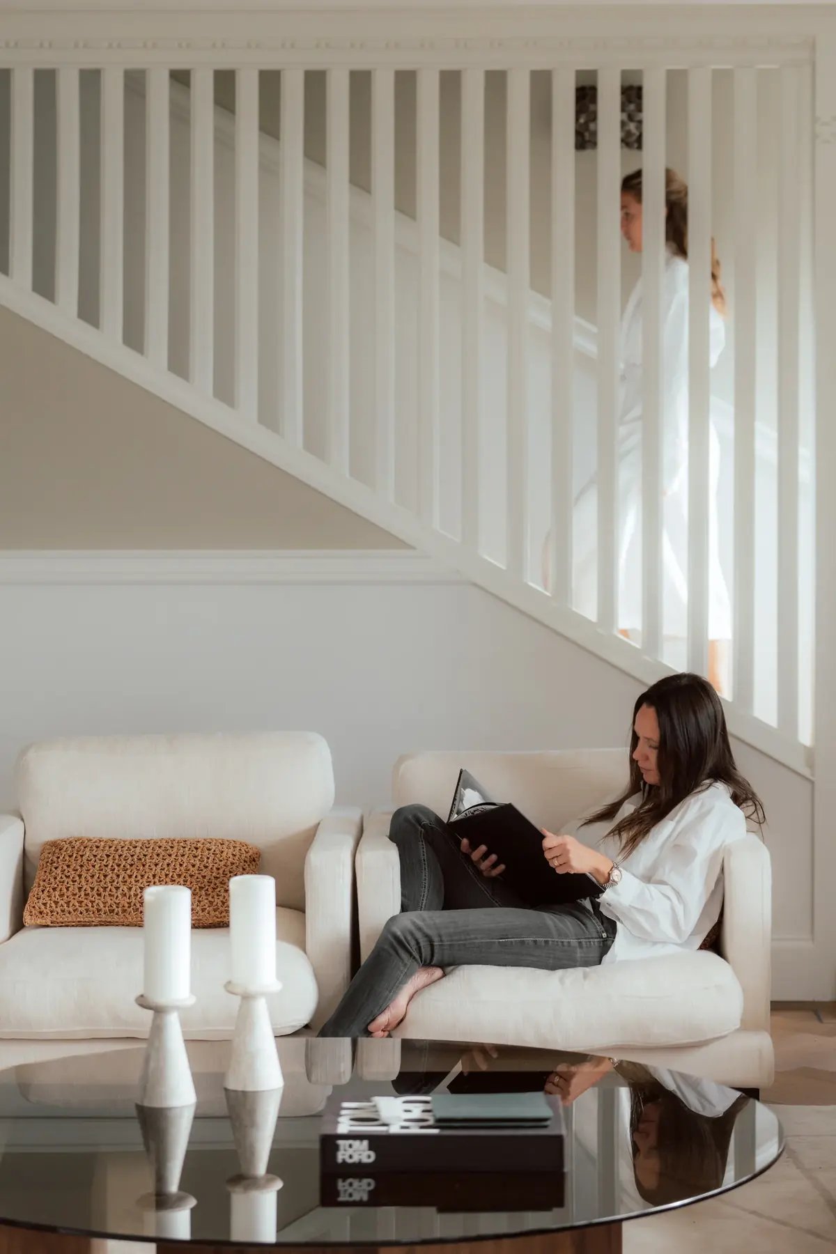 A guest reading in the Villa Sand living room